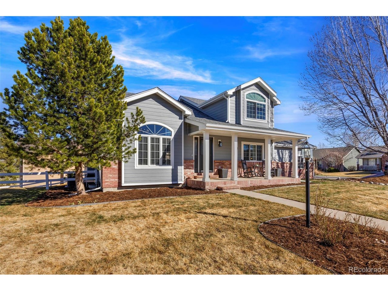 WOW!! What an opportunity! Big-ticket updates are already done: new roof (2023), HVAC system (2023), water heater (2023), many new windows (2023/2024), new siding, trim, and gutters (2024), new garage doors (2024), brand-new carpet throughout (2026), and more! PRE-INSPECTED & MOVE IN READY. Set on a large corner lot in a cul-de-sac and backing to open green space, it offers a rare mix of privacy, mountain views, and spacious living. Inside, hardwood floors and vaulted ceilings create an open, comfortable feel. The main level includes formal living and dining spaces, a family room with a double-sided fireplace, a breakfast area, half bath, and laundry room. The layout flows easily, and natural light pours in throughout the home. The kitchen is well-designed with an island, generous cabinetry, and plenty of workspace-functional for everyday living and easy for gathering. The upstairs has a beautiful primary bedroom with a walk-in closet that extends far beyond expectations, and a full bathroom with double vanity, soaking tub, and walk-in shower. The finished basement gives you flexible extra space for whatever you need, including two rooms, a full bathroom, storage, and a large recreation area. Out back, the two-level deck and large backyard with terraced garden gives you space to relax or entertain while taking in the open space behind the home. Bonus...occasionally you'll see elk passing through the neighborhood. The three-car garage provides plenty of room for vehicles, storage, and gear. Location can't be beat - conveniently located with easy access to Highway 34/Eisenhower, 1st Street, and 14th Street, making it simple to get around Loveland. Schedule your showing today! Clear pride of ownership make this Mariana Glen home stand out.