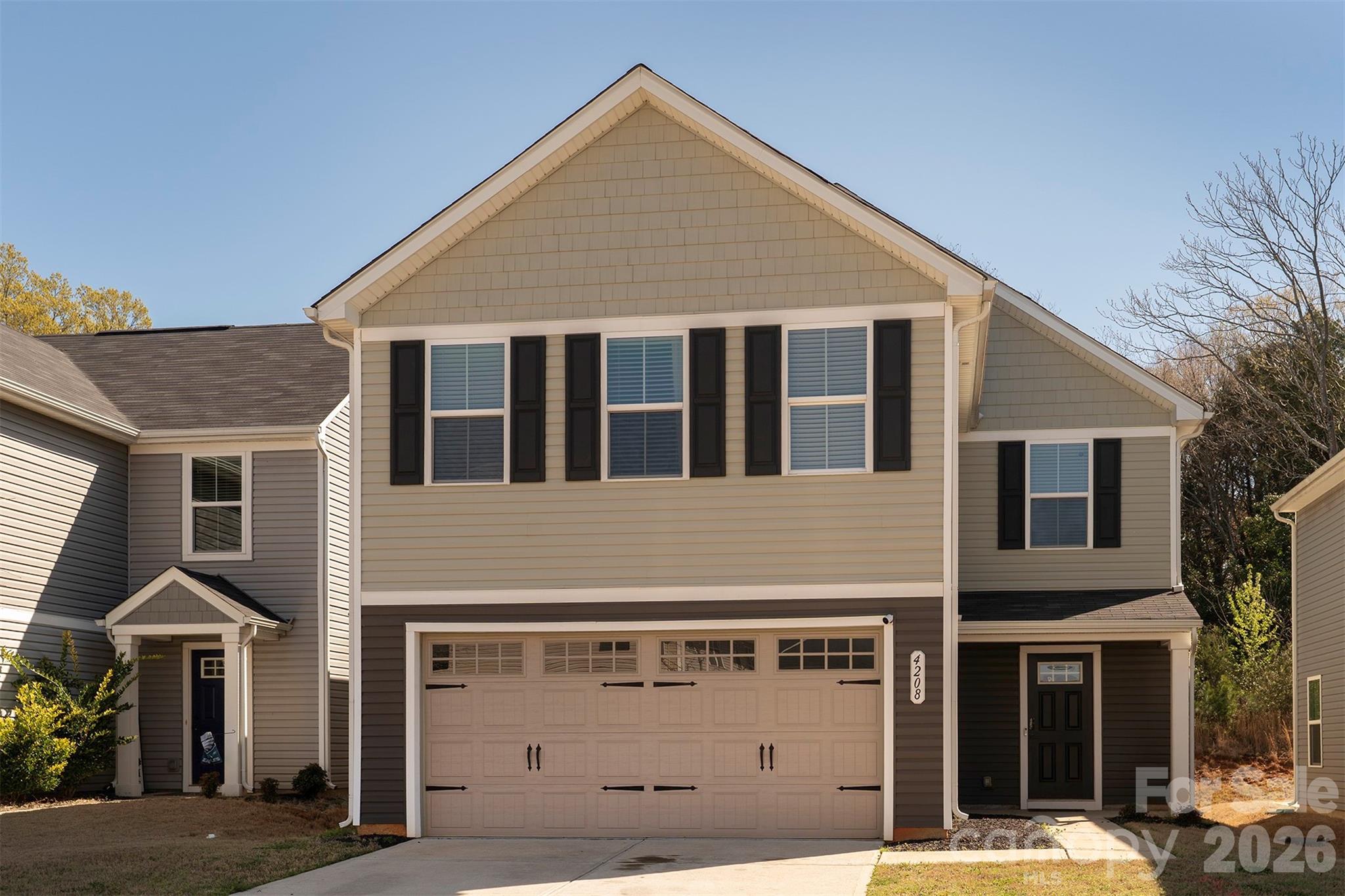 Charming 4-bedroom, 2.5-bath home in Charlotte featuring an open main-level floor plan that fills the space with natural light. The roomy kitchen is built for entertaining, with a huge island, granite countertops, and a sliding glass door that opens to the back patio—perfect for indoor-outdoor living. Spacious bedrooms, modern baths, and thoughtful flow make this home ideal for family living and hosting. Washer and dryer do not convey.