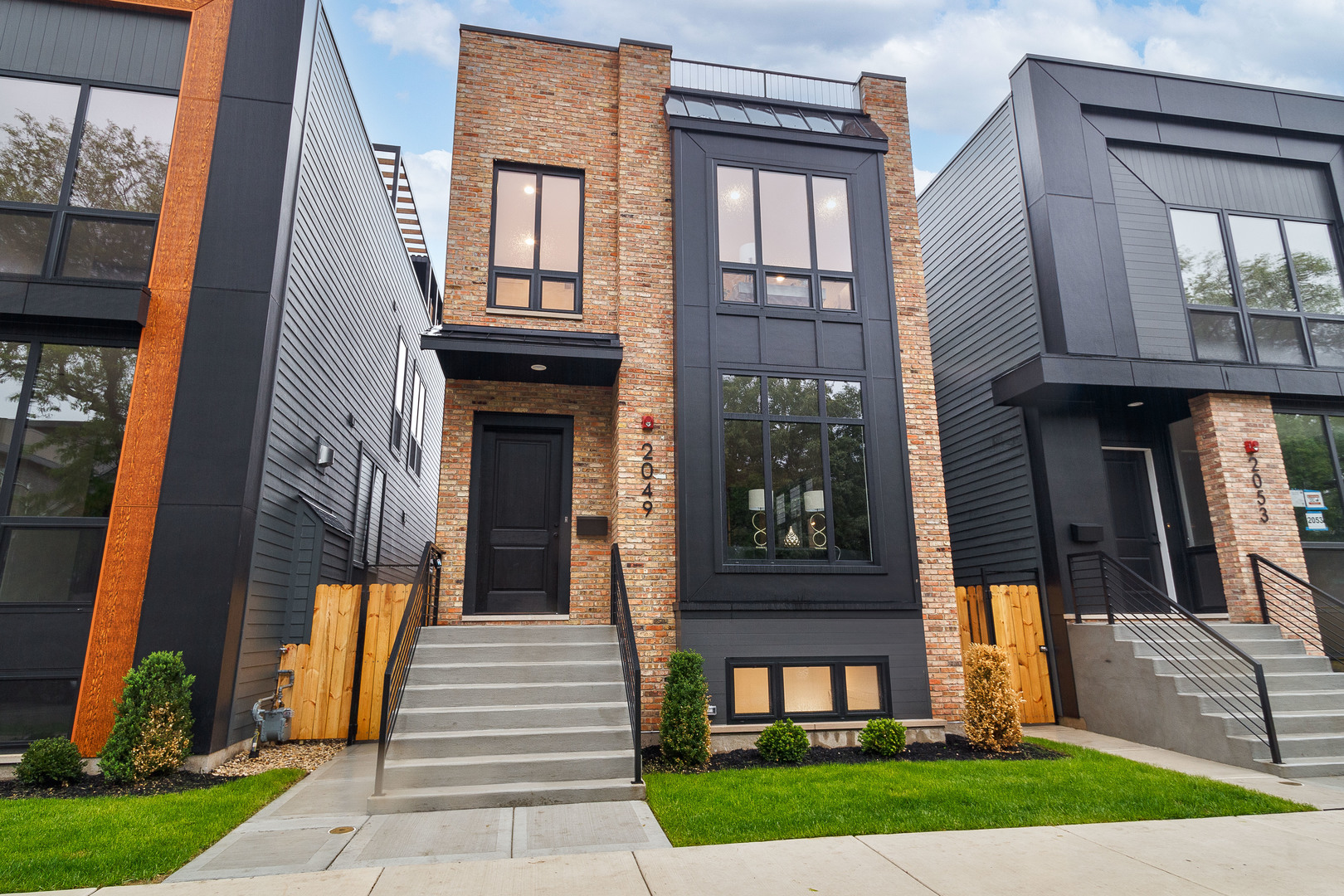 Construction is complete on another stunning home in our 7-home development in the heart of West Town, The Race Collection! Contemporary facade with clean lines and brick accents. Extra wide floor plan with high end fixtures and finishes. Modern, sun filled spaces with oversized windows. Open concept main-level perfect for entertaining. Combined living/dining area features direct vent gas fireplace with floor to ceiling surround, and built-in display cabinet. Chef quality kitchen includes top of the line Sub-Zero and Wolf appliances, custom cabinetry with quartz countertops, butler pantry, and island with waterfall counter and bar seating. Expansive family room with second gas fireplace and a wall of back windows. Upper level primary suite with two WIC's with custom organizers, and ensuite bath featuring a freestanding tub, frameless glass shower, dual sinks, and heated flooring. Two additional bedrooms, full bath with tub and dual sinks, and laundry with Samsung washer/dryer and sink complete the level. Third floor wet bar opens to a roof deck with outdoor fireplace. Finished lower level features radiant heated flooring and includes a spacious recreation room complete with wet bar, fourth bedroom with large WIC, full bath with shower, utilities, and luxury vinyl plank flooring. Rear deck with staircase to garage roof deck with pergola. Prime West Town location close to restaurants, shopping, entertainment, and Smith Park! Easy access to public transportation and other great neighborhoods.