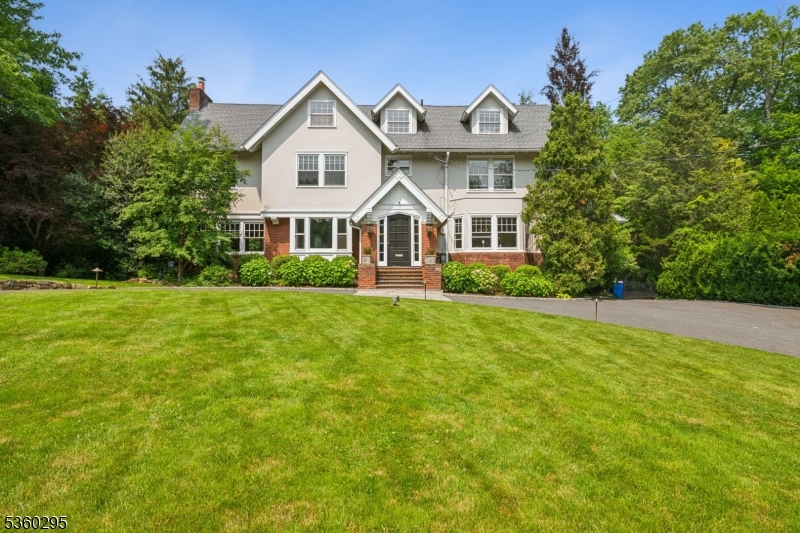 This spectacular 7 bedroom, 5.1 bath Colonial w/8244 sq ft of luxurious living space is ideally located on .73 acres of beautiful, level property w/ new saltwater pool (2022) on quiet street in prestigious Northside Summit, walking distance to downtown, the train station & #1 ranked Elementary School in Union County, Lincoln Hubbard Elementary School, crowned #1 in NJ by US News & World Report! Perfect blend of character & today's active lifestyle. 1st level features a grand double entrance hall, living room w/ gas FP, dining room w/ leaded glass cabinetry, butler's pantry w/ new quartz countertops & backsplash, new Bosch DW & new wine fridge, stunning gourmet eat-in kitchen w/ Subzero, Bosch DW & Thermador 6 burner gas range & double ovens, totally open to family room w/ gas FP & walls of windows w/ views of spectacular, huge level totally fenced backyard w/ new heated saltwater pool, & elegant wood paneled office w/ built-ins, gas FP & new sliders to bluestone patio & property. 2nd level has Primary Suite w/gas FP, massive walk-in custom closet & spa-like bath w/steam shower & jacuzzi. 3 more bedrooms share 2 more full updated baths w/shower over tub, linen closet & back stairs. 3rd level has 2 more bedrooms - 1 w/ a skylight, walk-in closet & full bath. Lower level has recreation room w/ gas FP, nanny's suite w/ full bath, laundry room, wine cellar & walk out access. This stunning Colonial on quiet street in prestigious Northside is the dream home you've been waiting for!