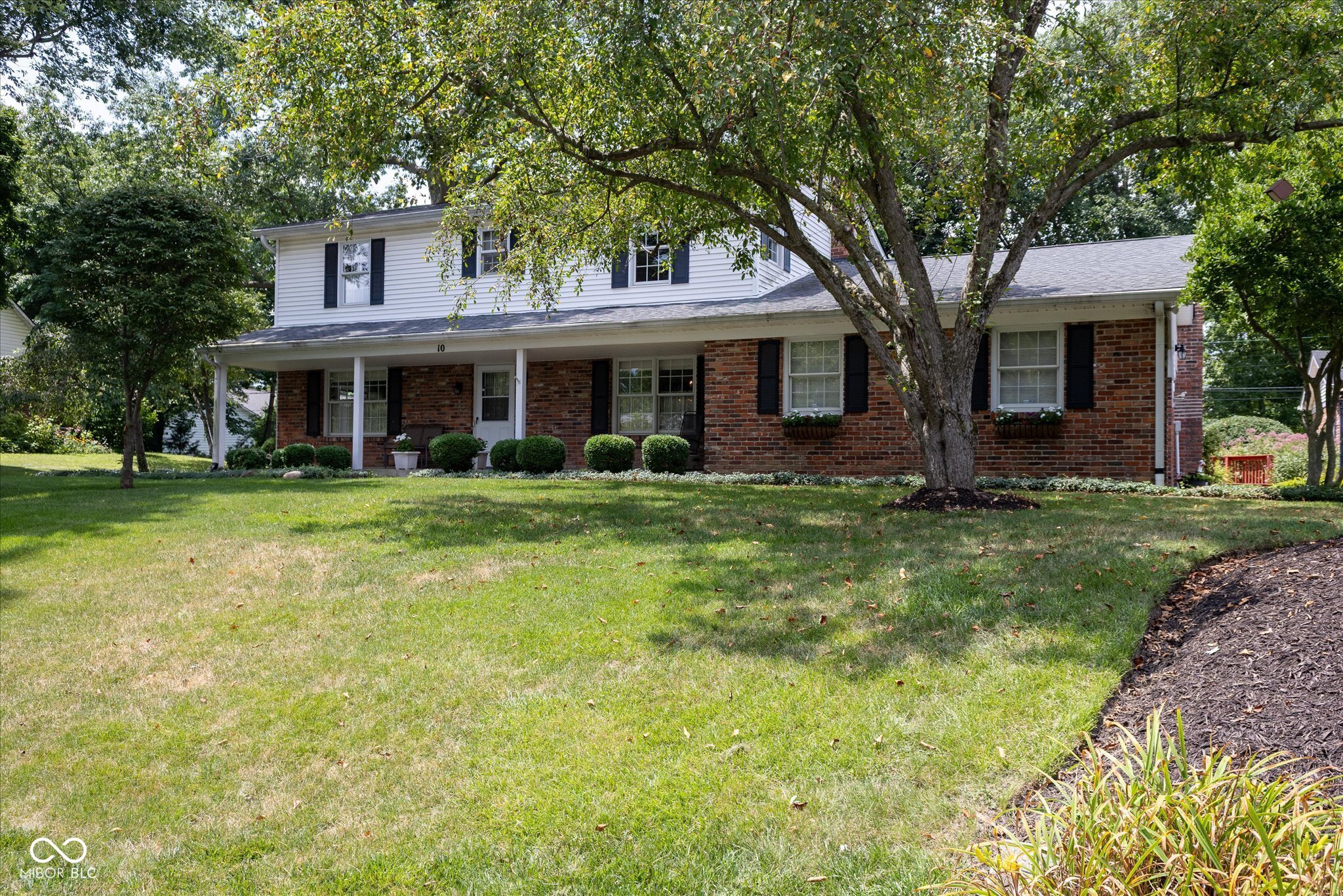 Nestled on a .60-acre cul-de-sac lot in Zionsville's Colony Acres, this 4 bedroom, 2.5-bath home is ready to welcome its new owners.  Home is being sold As-Is.  Features in this 2,234 square foot colonial 2-story include a formal living room & formal dining room for entertainment. Gather in the large family room with a gas fireplace or in the 3-season sunroom.  The backyard offers a wonderful sense of privacy and space with a large deck that is partially covered, perfect for enjoying outdoor moments.  A storage shed provides additional storage, keeping the outdoor areas organized and clutter-free and additional storage is built onto the deck!  All 4 upstairs bedrooms have custom California closets and ceiling fans.  2 car attached garage, and 2.5 car detached garages for all your parking needs - create a workshop or a craft area - the possibilities are unlimited!  Neighborhood has a pond with dock and is in a great location with Zionsville schools, easy rail trail access and the Village is within walking distance!