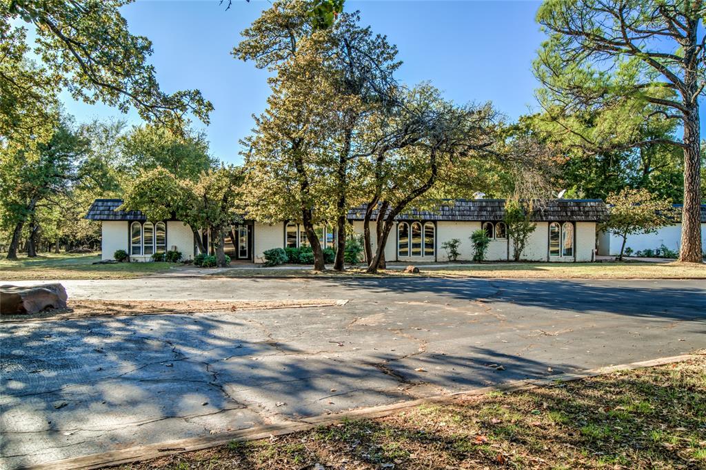 Bring your "vision" and revision to this fantastic opportunity of country living but still in town! A rare chance to buy a classic home on 10 wooded acres in Edmond city limits right across from famed Oak Tree National Golf Course. The 3438 sq. Ft., 4 bedroom home with swimming pool has a cool 70s retro layout with multiple living areas, huge picture windows overlooking the expansive grounds and a few fun surprises as well! This house has so many possibilities just waiting for it's next chapter with your imagination. This property features a great courtyard design, equestrian barn, and equipment barn. The 10 acre property can be divided. Have it all, the great outdoors, the wildlife, the seasonal views. Peaceful, elegant country living with the convenience of a city address. Sold AS IS
Call today!