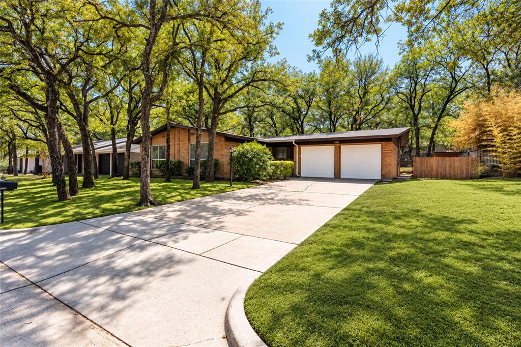 Multiple Offers Best & Final Monday, Sept. 28th midnight. Trees, Trees, Trees!! Prime Bedford location! This cute, updated 3-bedroom home is move-in ready and offers a host of appealing features. Enjoy the freshly painted interior and exterior, complemented by stylish vinyl wood-look flooring & tile—no carpet to worry about. The kitchen has new appliances, refrigerator countertops & cabinets.. The bathrooms have been tastefully updated, and ceiling fans are installed in every bedroom for year-round comfort. The main bedroom has its own bathroom with a shower. Hall bathroom has a bathtub. The garage & front porch has attractive Epoxy flooring. A brand-new roof was installed in 2026, giving you peace of mind for years to come. The property boasts a great-sized backyard, and a spacious 2-car garage. With easy access to Highways 183 and 121, commuting is a breeze. Don’t miss out on this beautifully maintained home ready for its next owner! No survey available. Green Grass has been photoshopped.