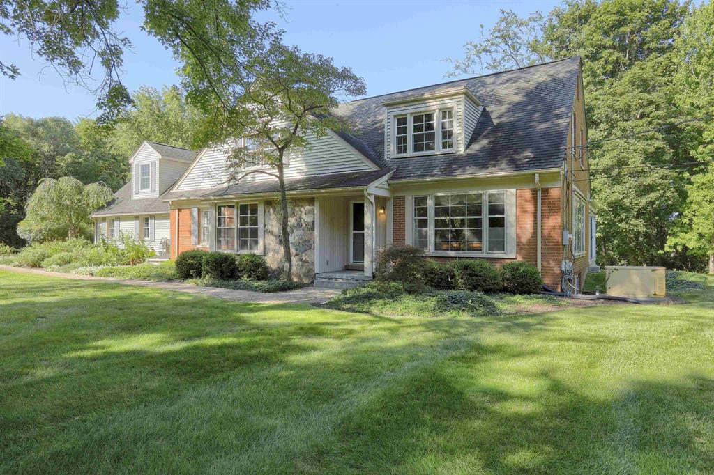 This manicured estate sits on 4.27 acres and includes a develop-able subdivided 1.02 acre lot to be sold together. Built in 1942, the 4-bedroom, 3.2-bath home offers 3,300 sq. ft. plus 1,400 sq. ft. of finished basement space. Located within the Rochester Community Schools. Features include an in-ground pool, a newly added private-entry office with its own HVAC system, and a secondary driveway easement for convenient access. Move-in ready with excellent potential for personalization. Make this grand estate your trophy property today!
