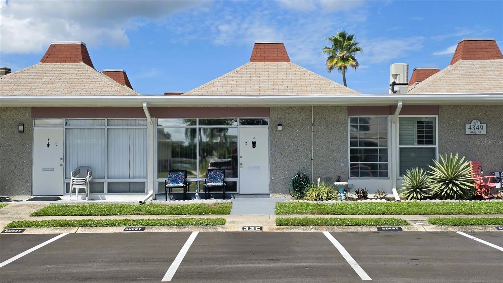 NEWER AC SYSTEM! Welcome to this bright, well-maintained one-bedroom condominium in Tahitian Gardens, a gated 55+ community. Expansive floor-to-ceiling living room windows fill the residence with natural light and create an open, inviting atmosphere. The home features tile flooring throughout, a walk-in shower, and a kitchen equipped with brand-new stainless-steel appliances, including a range, range hood, and refrigerator. Ceiling fans are located in the living room, kitchen and bedroom. The patio offers a partial lake view, and a private parking space is conveniently situated directly in front of the unit. Residents can enjoy the large, heated swimming pool, scenic community pathways, and lakeside setting. Tahitian Gardens also offers a variety of activities, including shuffleboard, arts and crafts, a cycling club, bingo, dominoes, and card groups. The community is conveniently located near dining and shopping, with CVS, Walgreens, Publix, and Aldi just minutes away. A short drive to Tarpon Springs provides access to the Sponge Docks, Sunset Beach, and Fred Howard Park. Tampa International Airport and St. Pete–Clearwater International Airport are both less than an hour away. The property is easy to show, and all reasonable offers will be considered. This residence is an excellent option for a primary home or seasonal retreat.