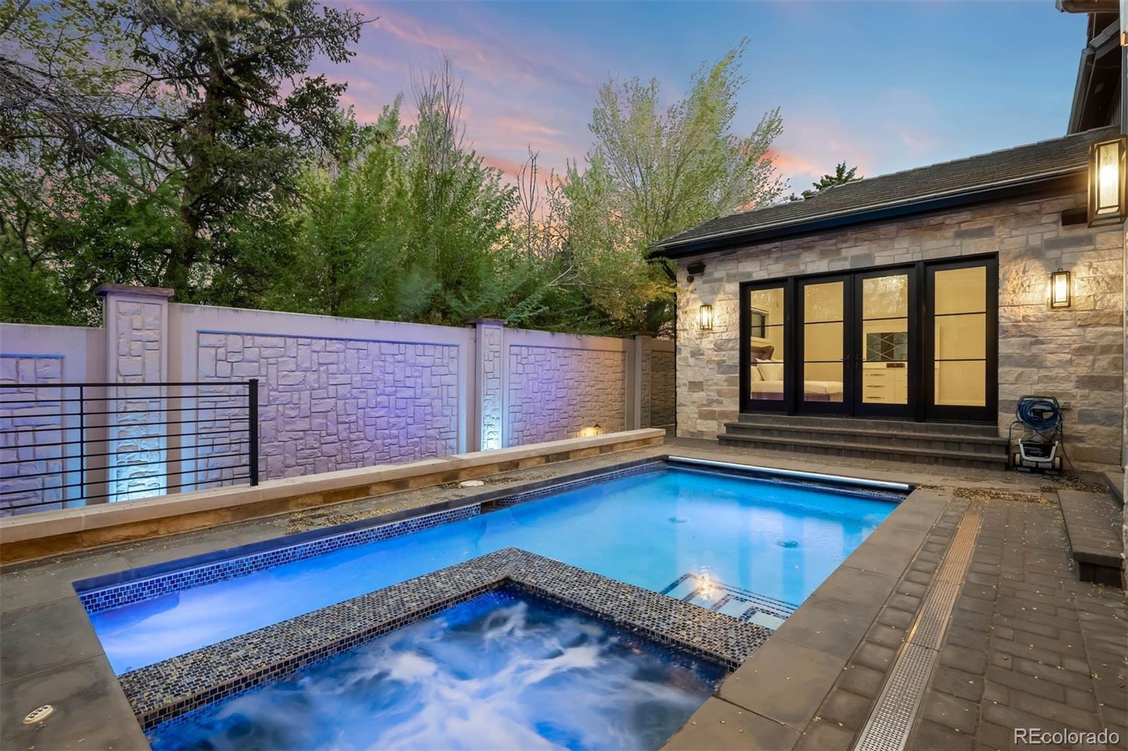 The gated Cherry Creek enclave of CEDAR LANE proudly showcases its crown jewel! One of the largest lots in the community proves to offer an experience unmatched by others. This substantial property creates an impression the moment you arrive. With a paved brick driveway, which converts to the only basketball court in Cedar Lane, and TWO CUSTOM GARAGES sure to impress any car aficionado with its ample parking for 6+ vehicles. Upon entering the estate, you are welcomed with 20' ceilings where walls of glass with automated treatments frame the homes OUTDOOR ENTERTAINMENT PAVILION steps from the POOL AND SPA. Summers will never be the same! The estate continues to impress with a MAIN FLOOR PRIMARY WING, MAIN FLOOR EXECUTIVE OFFICE with Miele coffee station, CHEF'S KITCHEN featuring a designer range hood, and an ELEVATOR TO ALL 3 LEVELS. The upper wing provides 3 sleeping quarters with one ensuite and an additional shared bath. Opposite is a billiard lounge which can accommodate a second home office or additional guest quarters, perfect for an au pair. Descend to the lower level and you will find Entertainment Paradise! The large theater television gives movie vibes while the bar outfits bubbles and brews. Get your "game on" in the arcade or improve your swing on the golf simulator. Retreat for wellness in the hot stone & Infrared cedar sauna after a focused work out in your home gym. Guests can find reprieve from the fun in either of the 2 additional bedrooms privately tucked away from the entertainment. This home's intelligent custom decisions include an Elan Automation System with control from cellular or Ipad panels. Time to venture out - walk or bike to Cherry Creek's most popular restaurants & shopping or enjoy nature at parks or on trails. This is Cherry Creek at its best! furniture is negotiable visit https://u.listvt.com/mls/186518761