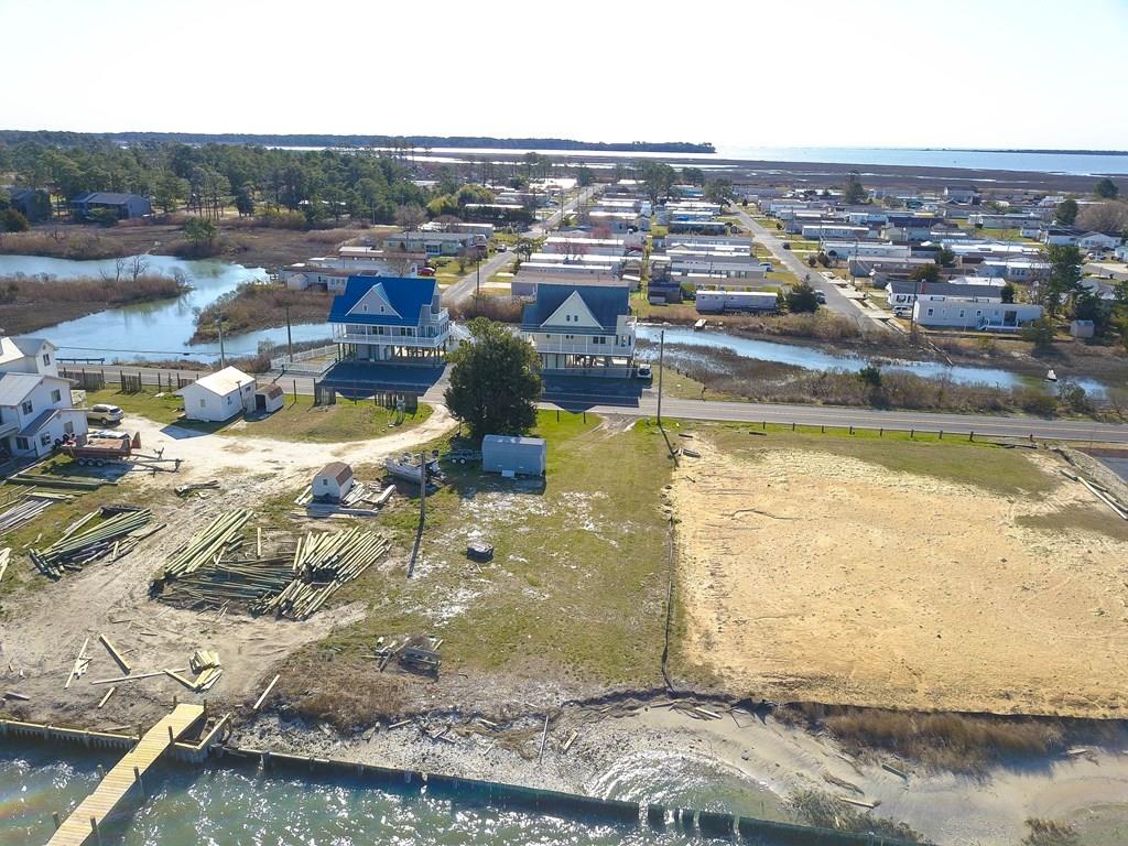 Said to be "One of the Highest Lots on Chincoteague. "PRIME WATERFRONT on The Chincoteague Channel. Great Location Near the Ocean. AMAZING SUNSETS! Over a Half Acre -Four Bedroom Septic Approved! Potential to subdivide. MULTI USE with C4 zoning! over $40,000  worth of permitted Sand Filled and Packed!  Build your Dream Home and Business here! *Potential to possibly subdivide.