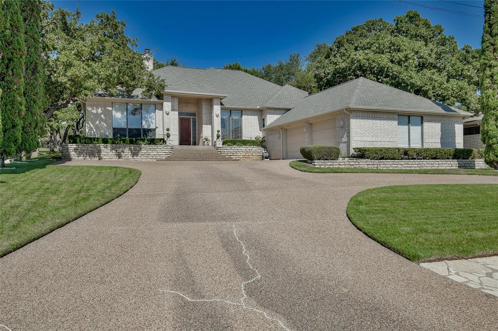 GORGEOUS FIRST-CLASS CUSTOM GOLF COURSE HOME sits on a quiet cul-de-sac street, framed on front by towering Italian Spruce trees in Decordova Bend Estates, a gated guarded community with pool, club house for dining and entertaining, golf, tennis and other amenities.  Peaceful hilltop setting with scenic views. Step inside to experience a touch of elegance throughout. Open floor plan is enhanced by heavy crown molding and beautiful wood vinyl flooring, creating a light and bright atmosphere. Neutral colors and professionally made drapes add sophistication to living room, formal dining and bedrooms. Window coverings to remain. Inviting family room overlooks the No. 6 fairway & features a wood-burning fireplace.  Beautiful built-in shelving & cabinets. Kitchen has granite counters and island and opens to the family room.  Spacious bedrooms. Seller says separate study could easily be converted to 3rd bedroom by adding closet doors. Covered patio measuring 45x12 ft for entertaining. Outside sound speakers on back porch. Oversized garage provides ample storage plus a 5x7 cedar closet that is heated and cooled.