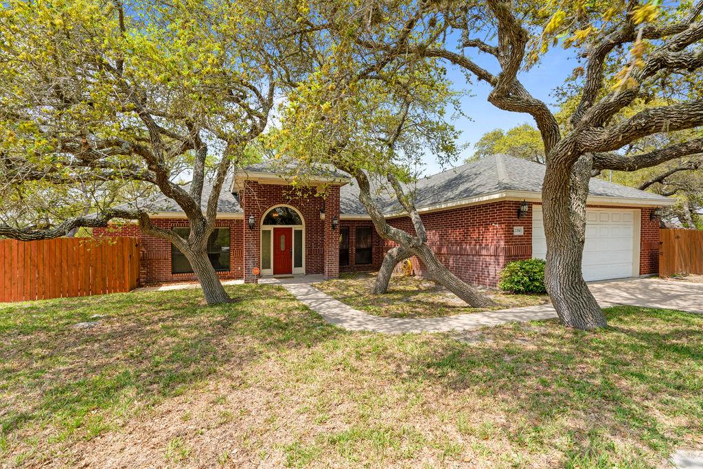 Country Living Close to Town! Experience the perfect blend of tranquility and convenience in this spacious home nestled on 1.99 beautifully maintained acres, just minutes from town. Designed with comfort and style in mind, this property offers a generous layout featuring the 3 large bedrooms, 2.5 bathrooms, two dining areas, and a dedicated office that could easily serve as a fourth bedroom. The heart of the home is the inviting living room, complete with a striking rock fireplace, custom built-ins, and an abundance of natural light pouring in through large windows that frame the lush backyard and majestic oak trees. The primary suite offers a peaceful retreat with ample closet space, a jetted tub, and a separate shower. Step outside to your own private oasis—a massive sun deck, custom heated pool with a waterfall, color-changing lights, and an attached spa with rock features. Ideal for entertaining or unwinding after a long day. Additional amenities include a large storage barn, security system with cameras, two water wells (one dedicated to the home, the other for outdoor use), septic system, and a water softener. This property offers a rare opportunity to enjoy the serenity of country living without sacrificing the comforts of modern life.