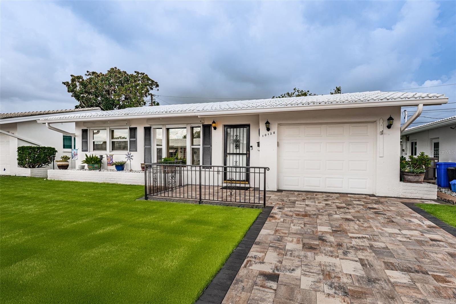 One or more photo(s) has been virtually staged. Welcome to Carefree 55+ Living in The Mainlands!

This beautifully updated 2-bedroom, 2-bath home with a 1-car garage is tucked away on a quiet street in the highly sought-after Mainlands of Tamarac, a vibrant 55+ community in Pinellas Park. Offering an active lifestyle and a low-maintenance way of living, this home is move-in ready and packed with desirable updates.

Inside, you’ll find solid wood floors in the main living areas, a bright and spacious layout, and a thoughtfully renovated kitchen featuring rich wood cabinetry, granite countertops, and plenty of storage. Both bathrooms have been tastefully updated, with the primary bath boasting a walk-in shower for comfort and convenience. Plantation shutters, double-paned windows with hurricane shutters, and an updated electrical panel (2018) provide peace of mind. Additional updates include a new water heater (2024) and brand-new sod (to be installed) for the yard.

The home’s curb appeal shines with a beautifully paved driveway and front porch, welcoming you with charm from the moment you arrive.

Beyond your front door, enjoy the Mainlands Golf Course right inside the community and a calendar full of social activities. Just minutes away, relax at Madeira Beach or Treasure Island (under 15 miles), explore the Salvador Dalí Museum (10 miles), hike at Weedon Island Preserve (7 miles), shop at Tyrone Square Mall (8 miles), or take a quick trip to Busch Gardens Tampa Bay (20 miles) for endless excitement.

With its prime location, stylish updates, and vibrant community, this Pinellas Park gem is the perfect blend of tranquil living and nearby adventure. Don’t miss your chance to call it home!