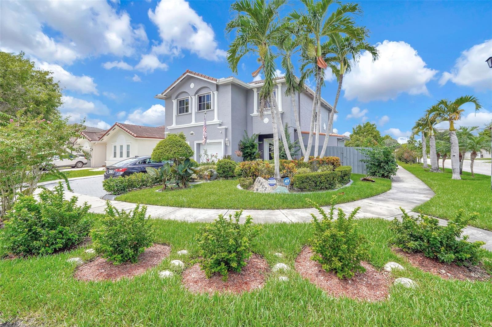 Sellers are motivated! Step into this stunning two-story residence nestled among mature landscaping in one of Miami’s most sought-after neighborhoods. Boasting 5 bedrooms, 3.5 bathrooms, and a thoughtfully designed layout, this home offers the perfect blend of modern elegance and functional living. The heart of the home is a gourmet, newly remodeled kitchen featuring sleek waterfall quartz countertops, custom built-in pantries, and top-of-the-line appliances—ideal for both everyday living and upscale entertaining. Soaring vaulted ceilings in the spacious living room create a light and airy ambiance, while large windows invite natural light and views of the lush exterior. Downstairs, you’ll find a convenient guest bedroom and a half-bath—perfect for visitors or a home office. Upstairs, the expansive primary suite offers a private retreat complete with three walk-in closets, spa-like ensuite bathroom featuring split double vanities, a jacuzzi tub, and a separate glass-enclosed shower. Two additional guest bedrooms share a well-appointed bathroom, and a second upstairs suite includes its own full bath and walk-in closet—ideal for multi-generational living or long-term guests. Step outside to your private backyard paradise—perfect for entertaining, with a covered patio, lush greenery, and mature fruit trees providing both shade and seasonal delights. Located within close proximity to top-rated elementary and middle schools, this home is perfect for families seeking quality education within minutes of home. With its ideal combination of luxury finishes, modern upgrades, and a flexible floor plan, this home is a true Miami gem. Don’t miss the opportunity to make it yours!