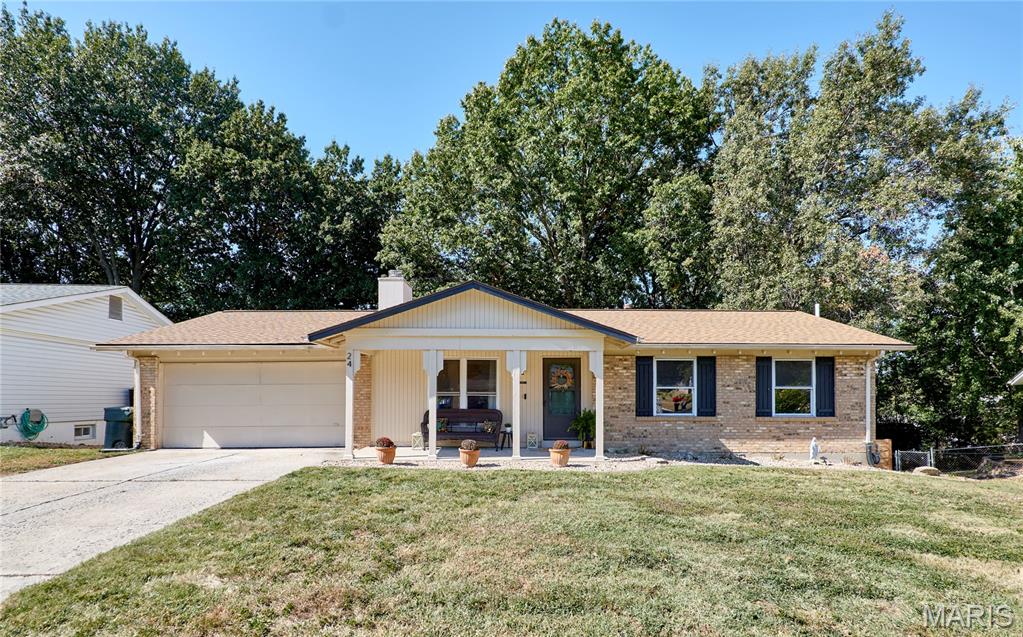 Welcome home to this charming 3-bedroom, 3-bath ranch in the heart of St. Peters! Conveniently located near schools, shopping, dining, and more, this home has plenty to offer! The inviting front porch welcomes you inside to a spacious family room featuring a beautiful brick gas fireplace. Continue into the dining area and functional kitchen, complemented by updated luxury vinyl plank flooring throughout much of the main level. The primary bedroom overlooks the backyard and features its own private full bathroom, while two additional bedrooms and a second full bathroom complete the main level. Downstairs, the partially finished walkout basement offers additional living and entertaining space, including a recreation room, wet bar, wood-burning stove, and third full bathroom. Whether you're hosting friends, watching the big game, or simply relaxing, there's plenty of room to spread out! Step outside and enjoy the spacious, fully fenced backyard with mature trees, a deck off the main level, and a patio accessible from the walkout basement. An attached two-car garage adds even more convenience. Don't miss your opportunity to make this St. Peters ranch your own!
