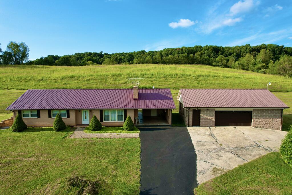 Welcome to this well-maintained brick ranch offering comfortable single-level living in a peaceful country setting, while still being conveniently close to town. The spacious layout features roomy bedrooms, a comfortable kitchen with plenty of space for cooking and gathering, and newer flooring throughout. Outside, enjoy a large yard with beautiful views and plenty of room for gardening, recreation, or simply relaxing and taking in the surroundings. A newer insulated two-car garage provides excellent parking, storage, and workspace. Outdoor enthusiasts will love the convenient location near Hungry Mother State Park, with easy access to hiking, biking, fishing, and other recreational opportunities. At the same time, you're just a short drive from all the shopping, dining, services, and amenities that Marion has to offer. If you're looking for a well-cared-for home that combines country charm, convenience, and comfortable living, this brick ranch is one you'll want to see!