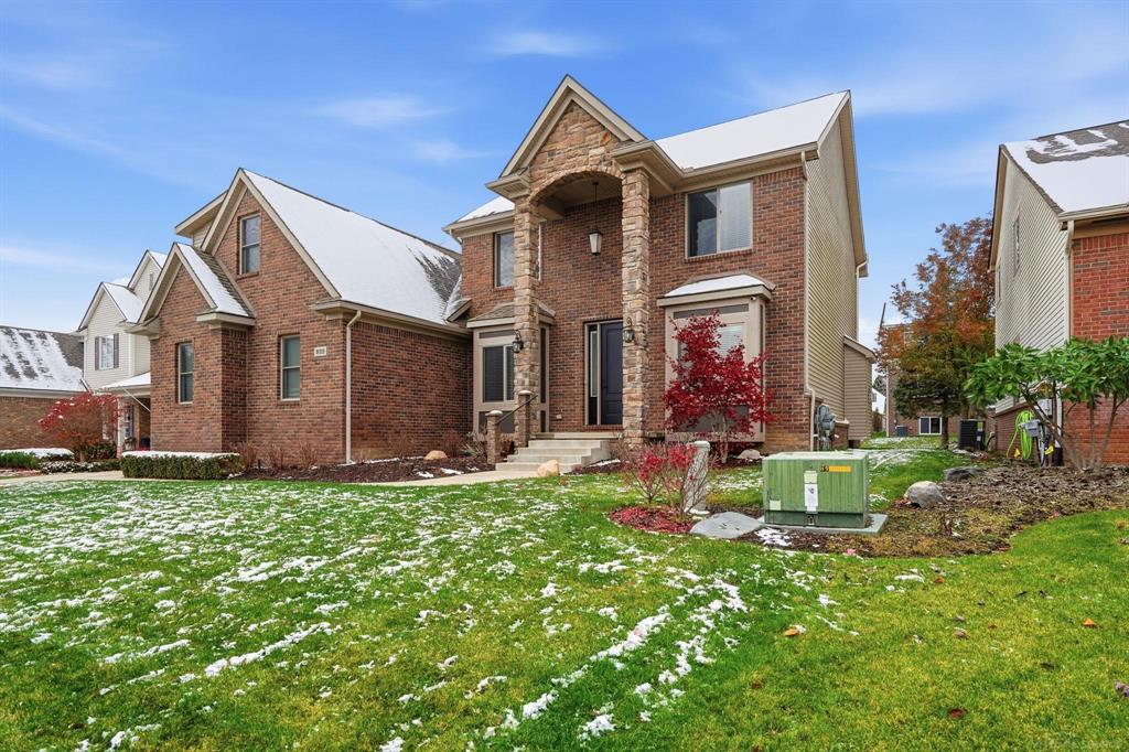 Welcome to this beautiful 4-bedroom Colonial in coveted Waterstone at Boulder Pointe, ideally situated across from the park.  This home is defined by luxury and thoughtful upgrades. Step inside to dramatic 10-foot ceilings (20-foot ceiling in the sun-drenched Great Room!) and hardwood floors throughout.  Premium features throughout include Andersen windows, custom 8-foot doors, a maintenance-free exterior, and a spacious 3-car heated garage. The private Owner's Suite offers the convenience of His & Her walk-in closets.  The lower level is an entertainer's dream: a professionally finished basement features a stylish wet bar and half bath. Outside, enjoy the meticulously maintained professional landscaping and beautiful stamped patio. Every detail, including a tankless water heater, ensures easy, luxurious living. This is elevated living-come see your new home!