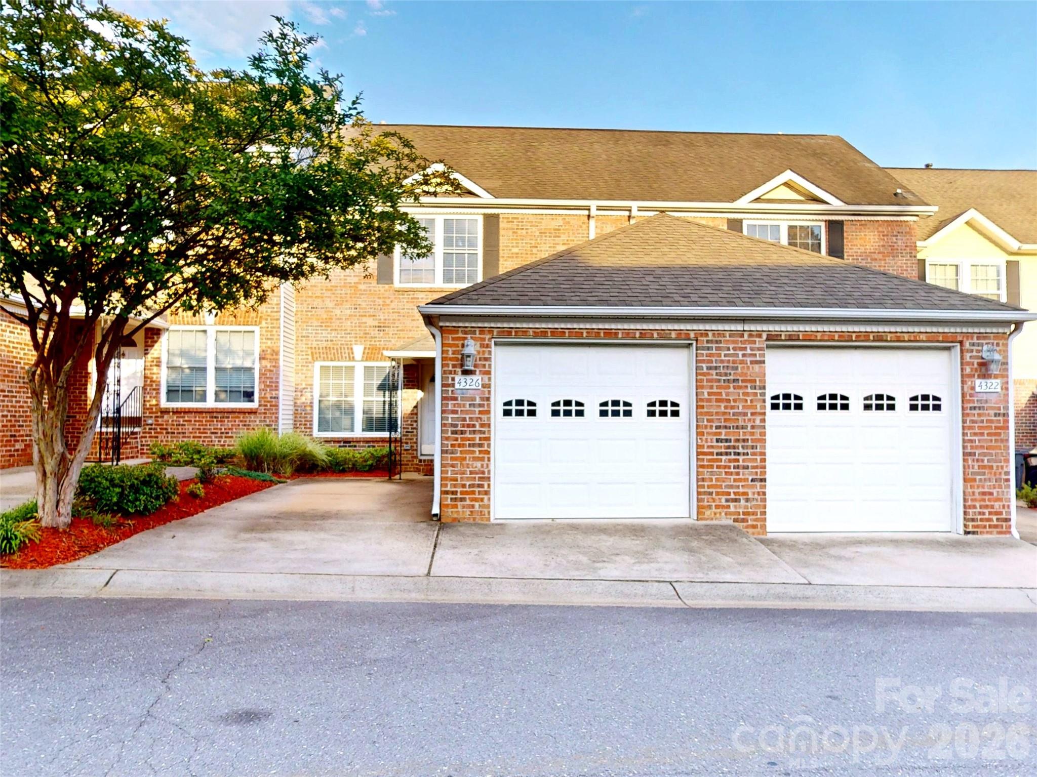 Welcome to this move-in ready 2-bedroom, 2.5-bath brick townhome-style condominium in the desirable Adare community. Freshly painted throughout, this home offers a clean, updated feel and a functional open-concept floor plan designed for comfortable everyday living and easy entertaining. The spacious primary suite features a large en-suite bath with dual vanities, while the generously sized secondary bedroom is served by a separate full bathroom. A convenient half bath on the main level is perfect for guests. Enjoy the convenience of an attached one-car garage, a private rear patio, and the low-maintenance lifestyle this community provides.Ideally located in Charlotte's desirable Steele Creek area, you'll enjoy quick access to I-77, I-485, Charlotte Douglas International Airport, Uptown Charlotte, Topgolf, Carowinds, shopping, dining, and everyday conveniences. This home offers an outstanding combination of location, value, and lifestyle. Residents enjoy community amenities including a clubhouse & outdoor pool.