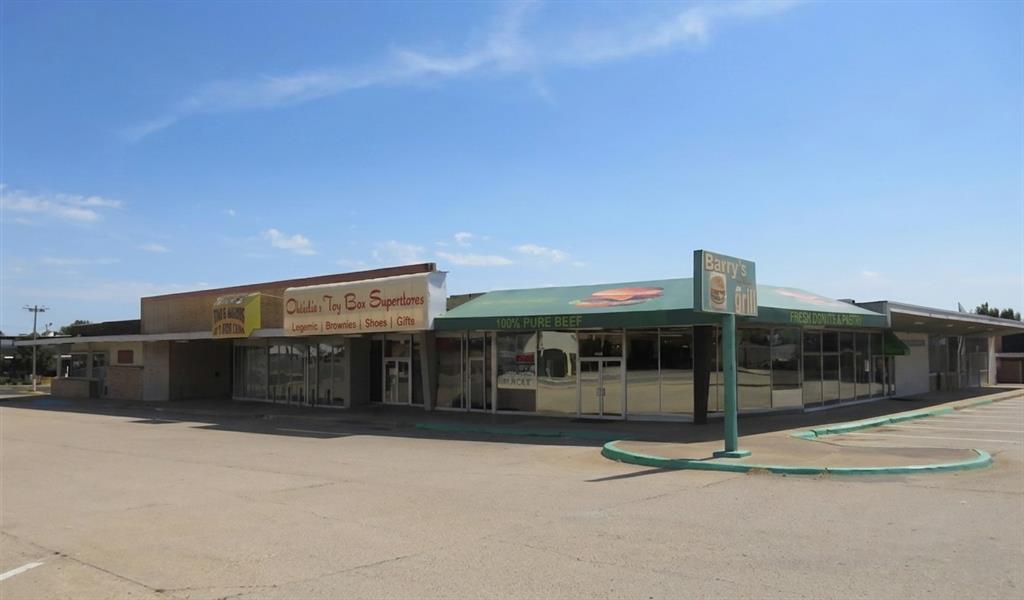 An opportunity that has so many possibilities.  Shopping center is  31,012 sqft(mol)under 1 roof with many longtime tenants and leases in place.  Several large units are empty and can be developed or leased out to a litany of tenants.  Your imagination is your only limitation.  Approx 11,748 of blacktop which provides plenty of parking for the entire Neighborhood Shopping Center.  The property runs from Nw. 31st and May to Nw. 32nd and May on the Ne side of the street.  The East side of the property has an open lot with approx 2.5 acres of land that can be developed into more commercial space or even a small apartment complex or multi family rental units.  *Buyer to verify all info and zoning*