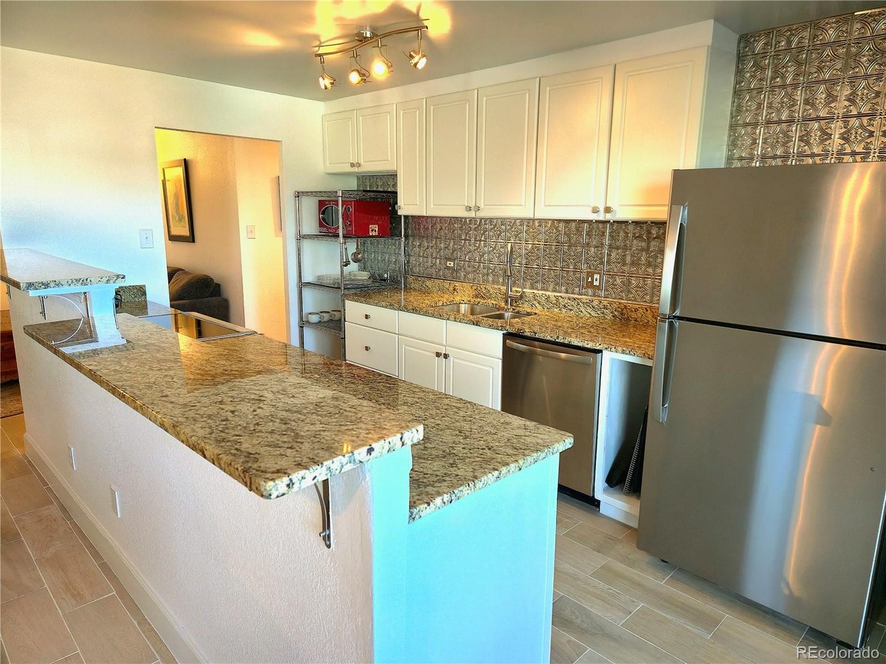 Modern 3rd-Floor Condo in Prime Denver Location2880 Locust St Unit 302Welcome to effortless urban living in this turnkey updated unit in Plaza de Monaco. This 3rd floor residence offers the perfect balance of style, comfort, and location-just moments from parks, dining, grocery, highway, and everything that makes this part of Denver so desirable.Step inside this updated unit to find a bright, open-concept layout filled with natural light. The living space flows seamlessly into a well-appointed open  kitchen featuring sleek cabinetry, stainless steel appliances, high end stove, and ample granite counter space-ideal for both everyday living and entertaining.  You will love the open great room complete with fireplaceThe spacious primary bedroom provides a quiet retreat, while the updated bathroom showcases clean, modern finishes with style. Thoughtful touches throughout the home create a move-in-ready experience with a low-maintenance lifestyle.Enjoy morning coffee or evening wind-downs with peaceful mountain views from your balcony vantage point. Additional conveniences include secure building access,off street parking, and easy access to nearby parks, coffee shops, restaurants, and major commuter routes.Whether you're a first-time buyer, investor, or looking for a lock-and-leave city home, this unit delivers location, lifestyle, and value.Highlights:3rd floor unit with great natural light,Open-concept living and dining,Updated kitchen with stainless appliances,Updated bathrooms,Secure building access,garage parking,New Paint,New Carpet,Community indoor and outdoor pool ,Gym, same floor laundryand Common areaLocation:Ideally situated with quick access to downtown, and major thoroughfares.