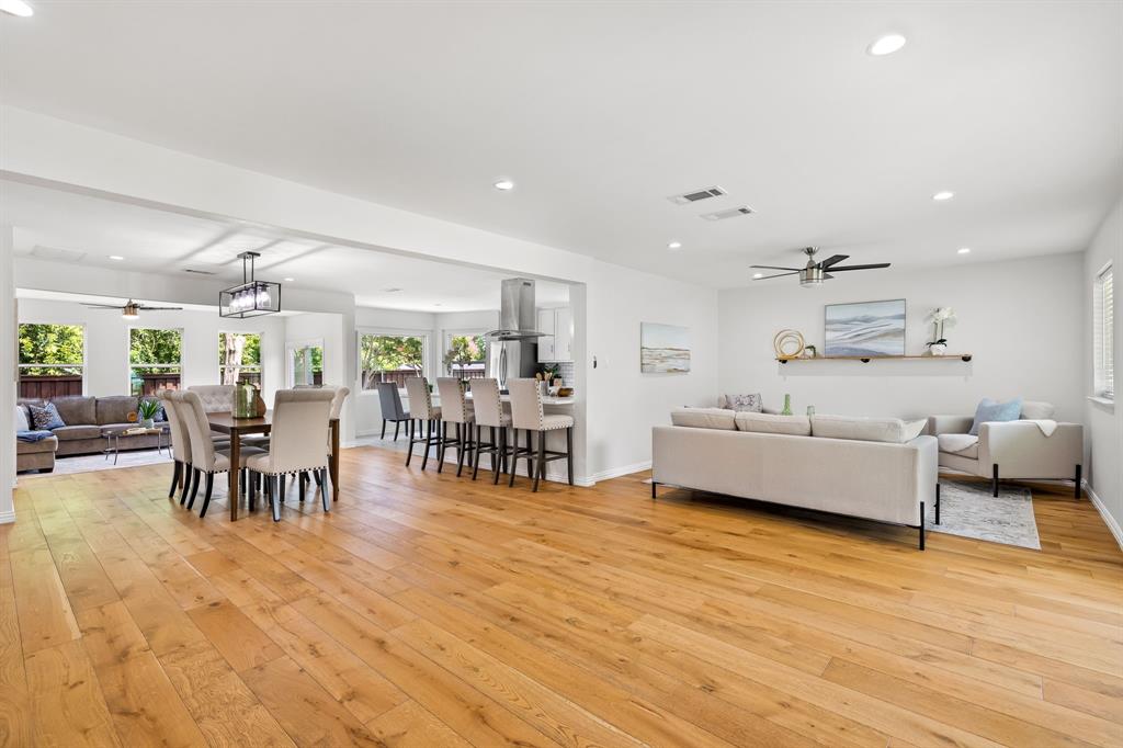 Discover the beauty of Lochwood with this 2-story stunner situated on a corner lot. Natural light soaks the open spaces on this dreamy home, with the perfect floor plan to entertain guests. 2 large living areas, one front & one in back, provide flexibility to create the spaces you desire. Large, inviting kitchen features elegant quartz c-tops & is thoughtfully positioned adjacent to the central dining room. Primary suite is conveniently located on the 1st level & boasts 2 walk-in closets along with a fantastically remodeled bathroom, including quartz c-tops, dual sinks, & oversized frameless glass shower. 2nd level has two generously sized bedrooms, each with a walk-in closet! The bedrooms are separated by the updated guest bathroom, also featuring dual sinks and quartz c-tops. Most walls have been freshly painted with tasteful, neutral tones. Low maintenance yard in back with the perfect deck to soak in the outdoors! Lochwood living at its best, you'll find mature trees & creeks abound. Short distance to Lochwood Park- playground, walking trails, tennis courts, pickleball, basketball court & a party patio. Just a 5 min drive to White Rock Lake, the Arboretum, local eateries & pubs!