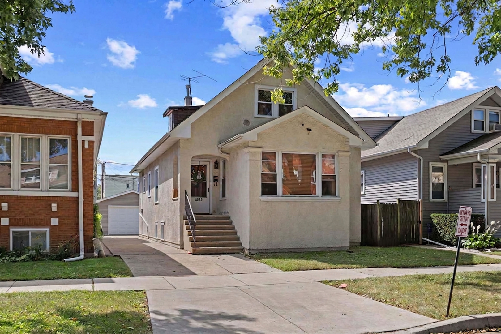 Welcome to this spacious 4BR/2BA single family home on an extra wide 33' lot in vibrant Portage Park! As you arrive from the quite one way tree-lined street, you'll love the ability to park multiple vehicles on the side drive or the two-car garage. The bright & spacious living room offers a cozy front sun room that makes for an excellent reading nook or office. The nice sized separate dining room is perfect for entertaining. While the eat-in kitchen boasts granite countertops, 42" maples cabinetry with nice storage and counter space. The back den is a great place to lounge or for the little ones to play in. There are two nice sized bedrooms on this floor with a full bathroom that's nicely appointed. As you work your way upstairs, you're greeted with a family room that can easily be converted into a bedroom. The additional bedroom, 2nd full bathroom, and kitchenette area is perfect for extended family living or a growing family. All of your living space is above grade in this house but the lower level has huge potential for even more space. The full basement offers 7' finished ceiling height and a rough-in bathroom for easy future expansion. There are dual furnaces for gas forced heat and a potential to install central air conditioning. The large back yard is nice retreat from city life and the large 2-car garage is accessible from both the street and alley. Great location that's easy accessibility to shops, restaurants, parks and everything that Six Corners has to offer.