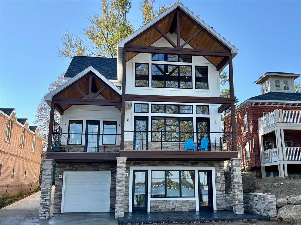 Once in a generation opportunity for brand new construction lake home, thoughtfully designed and crafted, on rare oversized estate-sized, sandy bottom, lake lot.'Maplewood Shore' represents the apex of Michigan lake living.  Designed with indoor/outdoor family entertaining in mind.  Gorgeous elevated lake views from 27 ft vaulted glass wall.  Beautiful herringbone cut luxury composite decking.Plenty of space for guests and all your lake toys with integrated, finished, lakeside garage + 5 car detached matching garage.Designer landscape package includedOption available for Buyer to use lake & dock now while you wait to close.Builder closing contribution incentive available, inquire now for details12-Month Builder Home Warranty IncludedViewings and offers encourag