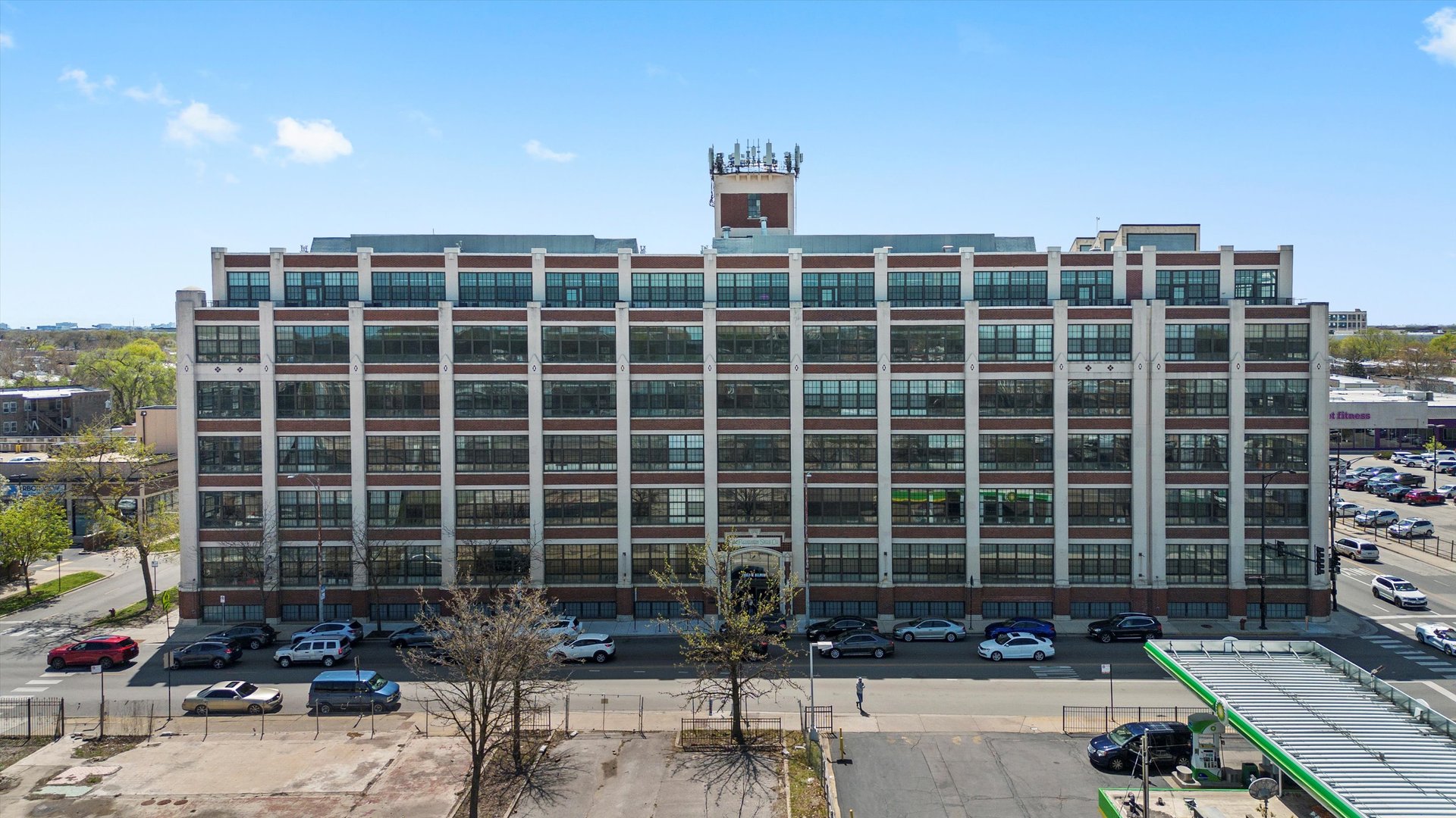 Welcome to the historic Shoemaker Lofts building in Avondale! This beautiful Penthouse 2-bedroom, 2-bathroom condo offers approximately 1500 sq. ft. of living space with soaring 11 ft. ceilings and large windows that flood the space with natural light. The open-concept living, kitchen, and dining area makes for a great entertaining space. The kitchen features a new stove, granite countertops, and ample cabinet storage. The master bathroom includes a spacious soaking tub, separated shower  and a double-sink vanity for added convenience. A heated parking spot is included. Building amenities: Doorman, gym, rooftop, community party room, and secure package delivery service. Conveniently located near public transportation, restaurants, and much more. Request your showing today!