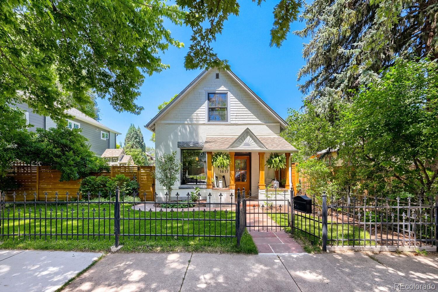 Perfectly positioned in one of Denver's most coveted neighborhoods, 1617 S. Pennsylvania is a masterfully updated Victorian that pairs timeless architecture with exceptional modern design. Every inch of this remarkable residence reflects an unwavering attention to detail , showcasing beautifully appointed living spaces and refined craftsmanship throughout. A thoughtfully designed floorplan seamlessly balances comfortable everyday living with effortless entertaining. Three luxurious bedrooms and two impeccably designed baths have been carefully curated to create a private retreat for rest and relaxation. Set on a double lot, the outdoor experience is nothing short of extraordinary. The urban garden retreat is lush with mature greenery, seasonal blooms, and intimate gathering spaces creating a serene backyard sanctuary in the heart of the city. Adding tremendous value and versatility, the detached carriage house offers 1017 sq. ft. of beautifully finished living space, complete with a bedroom, kitchen, two bathrooms, and a  cozy living area. Whether utilized as a guest house, mother-in-law suite, private office, or  income producing rental, this exceptional space provides flexibility without compromise. Just moments from vibrant shops, cafes, acclaimed restaurants of Pearl St., residents enjoy a truly walkable lifestyle. Grab sushi around the corner or take a stroll to the park. Celebrate the seasons on Sundays at the Peart St Farmers Market!!    Showings to begin Wednesday June 24.