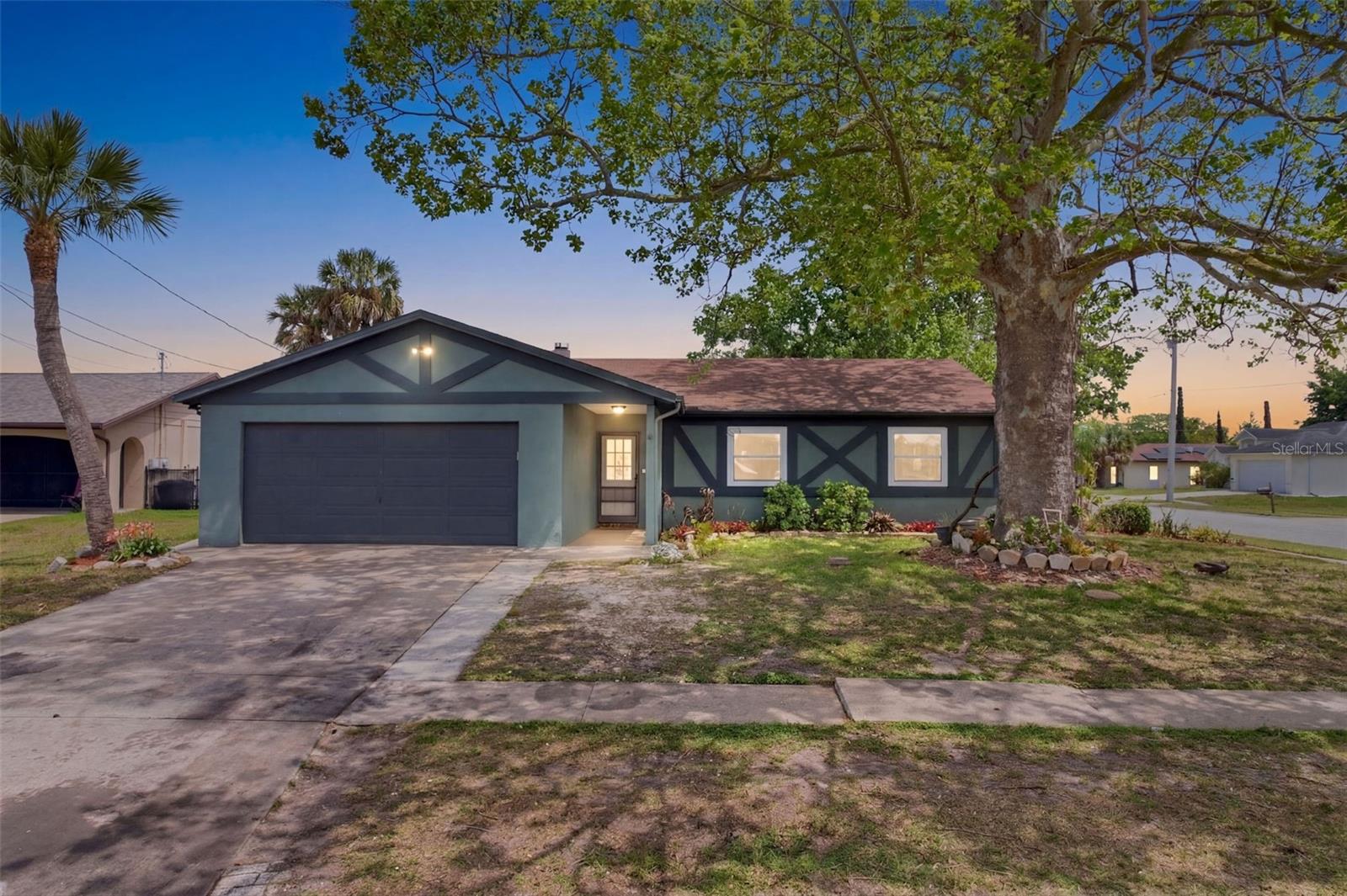 Situated on a fully fenced corner lot in Hudson, Florida, this well-maintained 3-bedroom, 2-bath home offers space, character, and peace of mind — all with a remarkably low HOA of just $10/month in the friendly Viva Villas Civic Association. NOT in a flood zone (X500), this home stayed high and dry through the 2024 hurricane season and extra insurance is not required. Step inside to a huge living room featuring soaring vaulted ceilings and a stunning wood-burning fireplace with dramatic floor-to-ceiling stonework. A large sliding glass door draws you out to your private outdoor retreat: a fully screened 277-square-foot patio (19'9" x 14') complete with a ceiling fan, perfect for morning coffee, evening entertaining, or simply enjoying Florida's legendary weather year-round.The master bedroom suite offers a true retreat with an en-suite bathroom and a generous walk-in closet. Two additional bedrooms provide flexibility for guests, hobbies, or a home office setup. The dining room is currently configured as an office, giving you options right from day one.Outside, the fully fenced corner lot is framed by lush, mature landscaping and offers dedicated gardening space for those with green thumbs. Sidewalks throughout the community add to the walkable, welcoming feel. All of this just minutes from Hudson Beach, SunWest Park's stunning spring-fed lake and white sand beach, Sam's Beach Bar, Skeleton Key Marina, and the legendary Gulf sunsets that make Pasco County's Nature Coast one of Florida's best-kept secrets. Tampa International Airport is just 40 miles south.