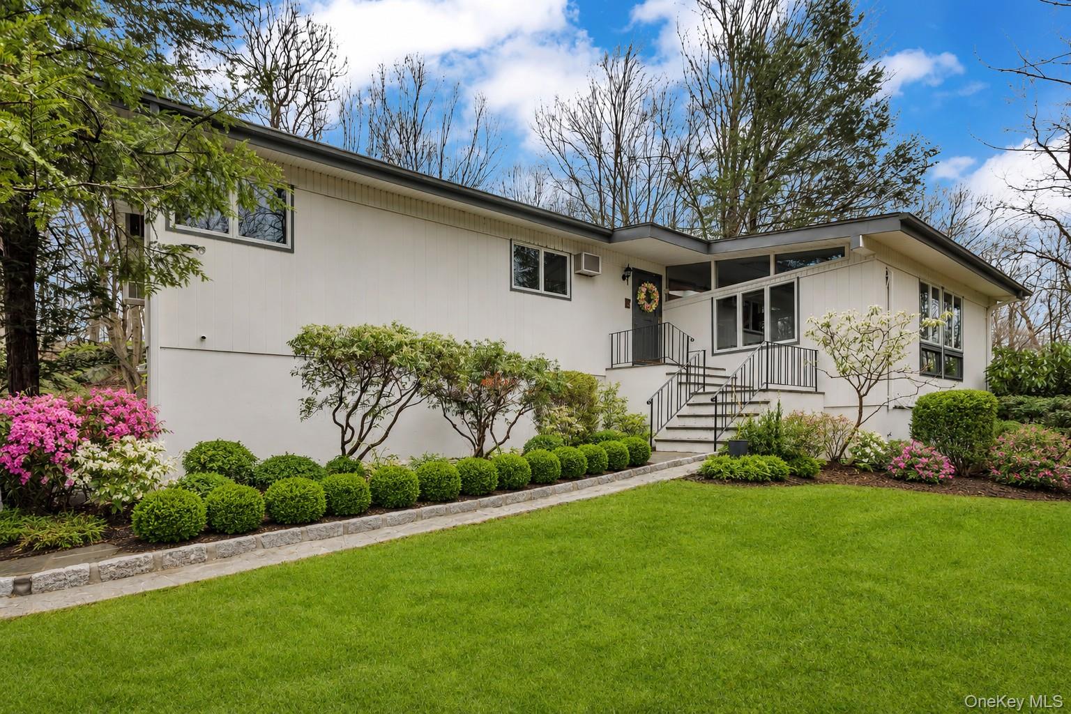 Modernist living meets woodland privacy. This unique Mid-Century Modern gem tucked away at the end of a meandering driveway lined with Belgium Block. Surrounded by 2.39 acres of nature, this home embraces the perfect setting tucked away but close to all! As you enter, you’re greeted by a step down, dramatic sunken living room featuring surround  windows that frame the outside and invites it in!  Hardwood flooring awaits under the carpets!The open-concept flow continues into a cozy gathering space with a classic fireplace just off the kitchen—ideal for morning coffee or evening cocktails. A formal dining room, with a beautiful view of the outside, a full hall bath, three spacious bedrooms including the primary offering a large walk in closet and en-suite which is a true retreat!     The lower level offers incredible versatility: a large recreation space, a dedicated home office, or yoga room, 4th bed plus  sliders that lead directly to the yard. You'll also find a third full bath and an unfinished area—perfect for a custom wine cellar or seasonal storage.Experience the privacy, the light, and the timeless style of Watch Hill Road. Close to schools, town amenities, shopping and 10 minutes to Metro-North station for NYC trains.