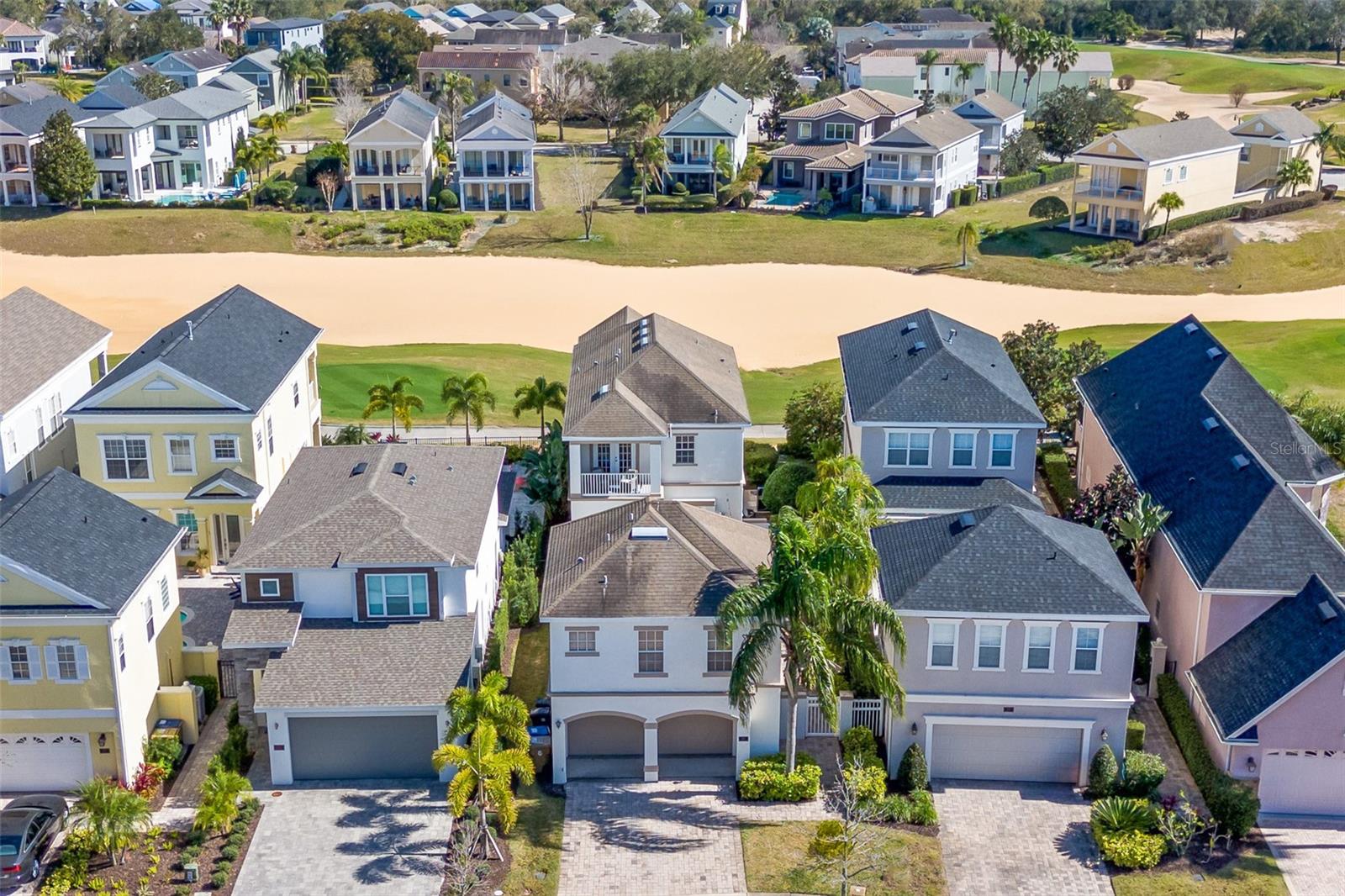 Situated in the highly sought-after Liberty Bluff neighborhood of Reunion Resort, this luxurious 5 bedroom 4.5 bath home is located in the exclusive Reunion Resort, a truly beautiful place with world-class amenities such as infinity pools, a full-service, spa, scenic walking trails, a fitness center, on-site fine dining and more.

Sold fully furnished. Currently in a short term rental program. Home has active Reunion club membership to give access access to club amenities such as three world class golf courses (designed by Arnold Palmer, Tom Watson and Jack Nicklaus) multimillion-dollar water park & six tennis courts.

Take full advantage of the Florida sunshine in your own private, spacious pool area. This beautiful outside area has plenty of outside seating. The pool area has a private pool with a spillover spa, pool fence, sun loungers, and an outside table with seating for 4 to enjoy your favorite meal with seating in a shaded patio area.

This home can accommodate up to 10 guests. On the first floor, you will find a bedroom with a king bed, flat-screen TV, ensuite bathroom with a tub, separate shower and double vanity, there are also French doors leading out to the pool deck. On the second floor, there is a bedroom that has a king bed, ceiling fan, and flat-screen TV. It also has a balcony overlooking the pool area with two chairs. Next, there is a master bedroom that has a king bed, flat-screen TV, and ceiling fan also with great views from the balcony of the golf course. The bathroom of this bedroom has a double vanity and a shower. The kid's bedroom has two twin beds, a flat-screen TV, a ceiling fan, and a sea theme. Lastly, the annex has a bedroom with a queen bed, a flat-screen TV, a small kitchen with a mini fridge, a microwave, and a bathroom that has a shower and single vanity sink.

The home includes a garage games room with a basketball game, an air hockey table, video games, and a large screen TV.

Reunion Resort is a large, 2,300 acre, gated community in Central Florida that is home to luxury vacation rentals. Reunion Resort in Orlando offers a wide array of amenities, including a 5-acre water park, three signature golf courses, and various dining and recreational options. Guests can enjoy multiple swimming pools, tennis and pickleball courts, and even a miniature golf course. The resort also provides on-site transportation and access to a fitness center and business center. The gates of Disney World are just 6 miles from Reunion. Aside from the luxury custom homes, the stunning views of the beautifully kept golf course are what sets it apart from other communities. Enjoy greater privacy in the perfect spot to unwind between days at the theme parks. There are numerous activities and amenities to keep both you and your family entertained. On the roof top of the eleven story Reunion Grande building you can see Disney fireworks on a clear night, also on the top floor you can enjoy a meal and drinks at Eleven. The Seven Eagles community pool, in the heart of the resort, boasts two relaxing Jacuzzis with plenty of poolside seating. Enjoy poolside refreshments and dining at the Cove Bar and Grill.