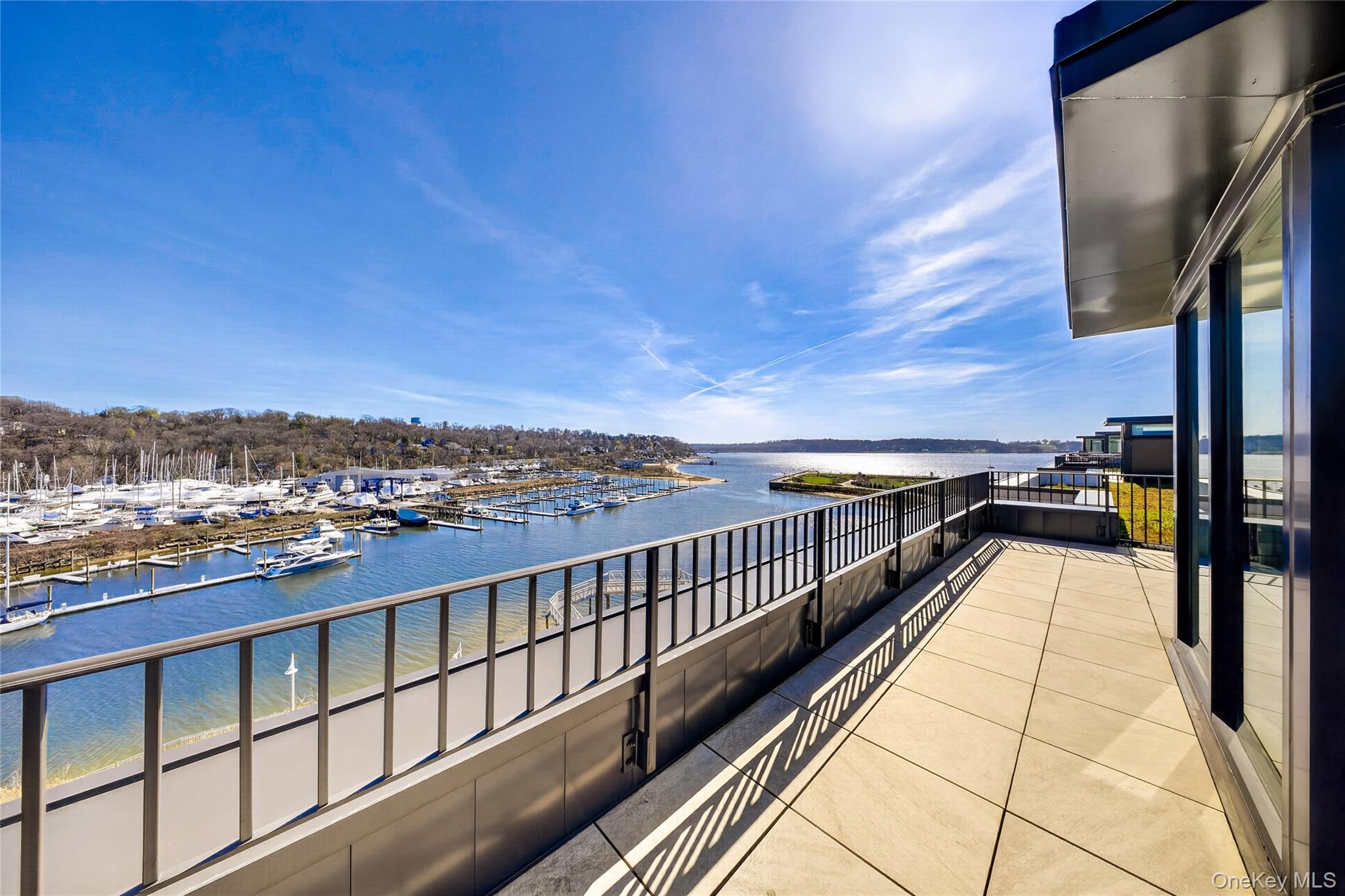 Welcome to this exceptional modern condo in the heart of Glen Cove. The Beacon At Garvies Point is a new development situated right on the Glen Cove Creek and the Hempstead Bay waterways, and features a vast array of amenities for improved quality of life. This oversized bright and spacious unit features an open layout, beginning with a beautiful entrance foyer, with a living and dining room, open kitchen, master bedroom with an en-suite full bathroom and walk in closet. 2 additional bedrooms and 2 additional full bathrooms follow. This unit also features a grand rooftop terrace with a grilling area, perfect for outdoor entertainment. Washer and dryer in unit. The building features amenities such as a large seasonal pool, gardens, concierge, doorman, billiards room, conference room, residents lounge, yoga center, movie theatre, library, outdoor kitchens, catering kitchen, package/mail room, garage parking, and storage. This unit comes with 2 garage spots which are spots #63, and #108 which features an EV charger. Storage unit #180 also comes with this unit. Close to shops, restaurants, parks, and schools. Close to the Sea Cliff LIRR station. Close to the N21 bus. Don't miss this chance to own this beautiful condo!