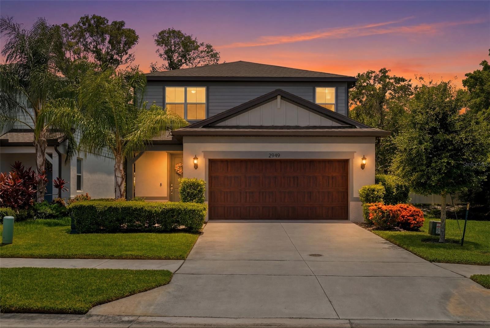 Virtually Staged. Welcome to Pier Pointe, where modern construction, thoughtful owner upgrades, and peaceful pond views come together in one of Pinellas County's most desirable newer communities.Situated on a premium corner homesite at the end of a quiet dead-end street, this meticulously maintained, better-than-new 4-bedroom, 3-bath home overlooks a serene pond and offers 2,207 square feet of stylish, comfortable, and functional living space. The open-concept floor plan features tile flooring throughout the main living areas, seamlessly connecting the living room, dining area, and beautifully appointed kitchen. The kitchen showcases quartz countertops, abundant soft-close cabinetry, and generous prep and storage space.Built in 2022, this move-in-ready home delivers the benefits of newer construction without the time and expense of post-closing projects. Unlike many new builds, this home is already fully finished with extensive owner upgrades, including Samsung smart appliances (refrigerator, washer, and dryer), custom built-in cabinetry in the living room and guest bedroom, custom cabinetry and shelving in the laundry room and two-car garage, ceiling fans throughout, and custom window treatments with blackout curtains in the primary suite and two secondary bedrooms.A first-floor bedroom and full bath provide exceptional flexibility for guests, multigenerational living, or a private home office, while a large under-stair storage area adds valuable everyday functionality.Upstairs, you’ll find three additional bedrooms, two full bathrooms, and a spacious loft perfect for a media room, playroom, fitness area, office, or second living space.Relax on the expansive screened lanai overlooking the pond, complete with a motorized privacy curtain for the sliding glass doors — perfect for morning coffee, outdoor dining, or unwinding at the end of the day.Further highlights include a Ring security system with three solar-powered cameras, window and lanai door sensors, a Taexx in-wall pest control system, removable hurricane shutters, smart home features, including a smart garage door opener and video doorbell, and energy-efficient construction with Low-E dual-pane windows and full concrete block construction.Nestled on a quiet street, Pier Pointe is an intimate 25-home community offering a welcoming neighborhood atmosphere just minutes from shopping, dining, parks, award-winning Gulf beaches, Clearwater, Downtown St. Petersburg, Tampa, and major commuting routes.Beautifully upgraded and impeccably maintained, this move-in-ready home combines quality construction, premium finishes, and an exceptional setting, offering the rare opportunity to simply unpack and enjoy.