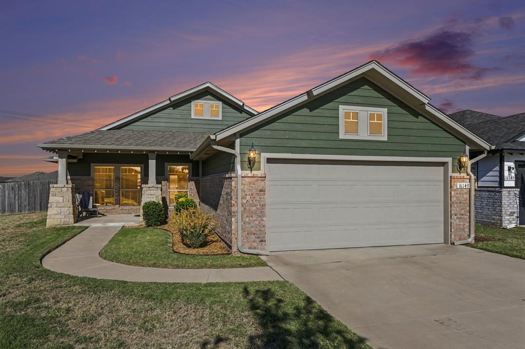 “Welcome Home”! An exceptional property in a highly desired South Oklahoma City community with Moore Schools. Combining exceptional curb appeal with some refined architectural details, this stunning home boasts an inviting brick and stone exterior, vibrant and manicured lawn, and a beautiful, covered porch entry. Inside you will experience a precious open-concept floor plan centered around a sizeable living area. Vaulted ceilings, an abundance of natural light, rich wood-look flooring, and multiple layout options create a warm ambiance for everyday living and entertaining. An adjacent gourmet kitchen is fully equipped with custom cabinetry, dark granite countertops, stainless steel appliances, gas range cooking, an oversized center island with bar seating, unique old world pendant lights, and a corner pantry. The primary suite is a sanctuary, featuring tall ceilings, more natural light blessings, and ceiling fan.  The expansive en-suite bath is overstocked with dual vanities, deep soaking tub, an enclosed shower, and walk-in closet. Guest beds are versatile and flexible spaces to accommodate guests and a home office. Both include ceiling fans and a discreet linen or collectable storage behind the entry doors.  Guest bath includes a single vanity and shower-tub combination. The sizeable laundry room allows you to operate freely and provides open above appliance storage. Backyard is a fully fenced and quiet retreat, perfect for sunsets, green space reflecting, or watching the planes and weather dance across your sky line. Covered patio provides outdoor dining, gardening, and entertaining options. The sink window opens to allow safe passage of the grilling items and beverage refills. Location is key, providing quick access to top rated schools, trendy dining, major shopping, and all major highways. Be sure to watch the video tour & take the 3D walk around. Then call a REALTOR for a private viewing.