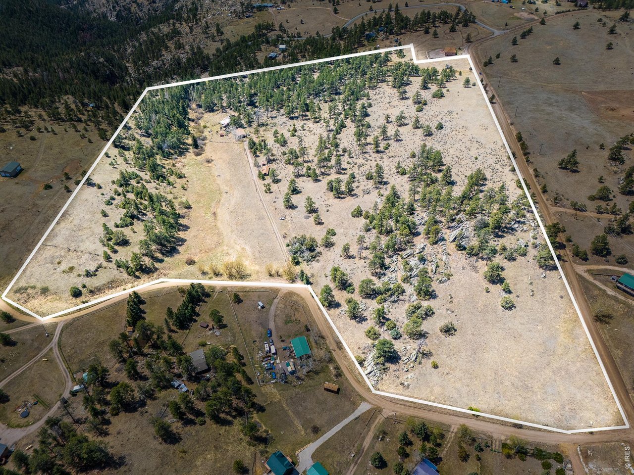 Own a piece of Storm Mountain history. Set on over 43 acres, this original homestead property dates back to 1918 and offers the kind of setting that is nearly impossible to find. Conveniently located near the access road yet still feeling truly secluded, the land is filled with trees, rock outcroppings, changing elevations, open meadow, and wide mountain views that create a private retreat. The property includes a 2-bedroom, 1-bath cabin, a detached 4+ car garage with a bonus rec room (pool table included), a guest cabin with a kitchen, bedroom, wood stove, and 3/4 bath, and a dry cabin most recently used as a hunting cabin. This incredible property is waiting for the right person who values history, privacy, and future potential. Come see this rare opportunity to create something special.