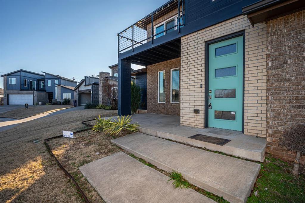 Contemporary custom 3-bedroom, 3-bath, two-story home offering a bonus room, flexible study space, and exceptional modern design throughout. The open living area features 9-foot ceilings, steel cable railing, sleek fixtures, an upgraded chandelier at the entry, and stained concrete flooring in the main living areas. The gourmet kitchen includes Silestone quartz countertops, a large island, walk-in pantry, coffee bar, wine fridge, and Thermador gas cooktop. The main-level primary suite offers a spa-like bath with oversized walk-in shower, soaking tub, and a walk-in closet conveniently connected to the laundry room. Enjoy three covered patios, including an upstairs rooftop deck, plus an extended back patio, raised garden bed, sprinkler system, and a private backyard backing to undeveloped land. Additional features include a mudroom bench. Neighborhood amenities include a pool, park, and pond. Prime location with quick access to the Turnpike and Portland, and walking distance to the elementary school—this home truly stands out in style, location, and quality.