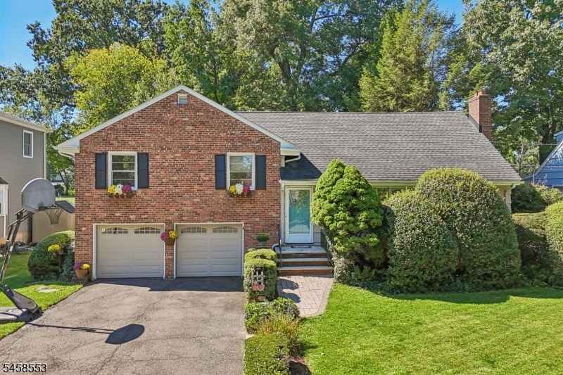 Welcome to 723 Willow Street. Ideally located just around the corner from Brookside Place School and Cranford High School, this spacious home offers generously sized rooms, a flexible layout, and inviting indoor and outdoor living spaces. Freshly painted and beautifully prepared for its next owners, the home is clean, comfortable and move-in ready. The living room features a wood-burning fireplace, while the family room offers a second gas fireplace for another cozy gathering space. The third-floor primary suite provides a private retreat with an updated en-suite bath, while second-floor laundry adds everyday convenience. Out back, the beautifully maintained yard opens to the field beyond, creating a park-like setting with a sense of space and privacy that's hard to find. A Weber gas grill connected directly to the home's gas line makes outdoor entertaining easy. With plenty of storage and convenient access to Union College, parks, Dreyer Farms and award-winning downtown Cranford, 723 Willow offers room to spread out, everyday convenience and a terrific Cranford location.