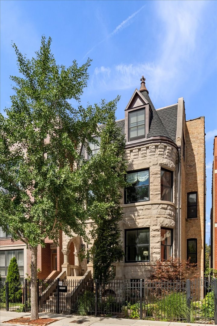 Experience classic architecture and modern living in this beautifully renovated (2018) Chicago Greystone. Situated on an oversized 30' lot, this spacious 3-bedroom, 3.5-bathroom duplex offers exceptional design, natural light, and abundant space for entertaining and everyday living. A dramatic bay window fills the living and dining rooms with natural light. The chef's kitchen features Bosch professional appliances, a large island, butler's pantry with beverage center, and a walk-in pantry. A dedicated breakfast room and adjoining family room flow seamlessly to a huge composite deck, ideal for grilling and entertaining. The lower level includes radiant heated floors, a bonus recreation room and three en-suite bedrooms. The primary suite impresses with a walk-in closet and spa-like bathroom boasting an oversized steam shower, soaking tub and dual vanity. The entire home features freshly refinished hardwood floors, new carpet and fresh paint. Additional highlights include one garage parking space, shared backyard, and abundant closet space. Situated on a quiet one-way street, just steps from Union Park, West Loop dining, the United Center, public transit (Pink/Green lines & bus), and expressways, this home offers an unmatched lifestyle with easy access to all your needs!