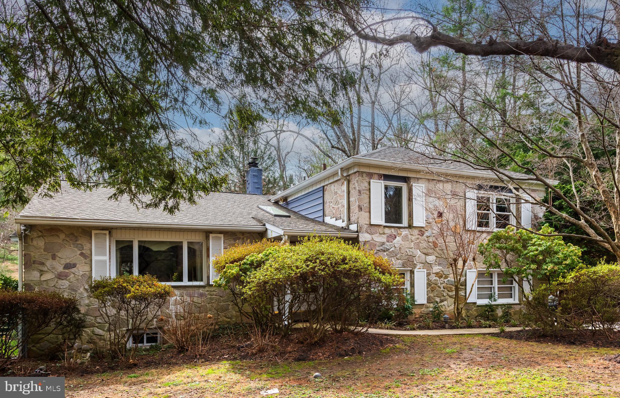 Decide now to buy this amazing 5 BR 4 full bath split level home on a cul-de-sac in the Lower Merion School District. This home has been lovingly maintained by the owners who just adore nature. The setting is gorgeous and private as the 1.09 acre lot boasts mature trees, perennials, climbing ivy, clematis on the arbor, and an in-ground heated pool with over $30,000 in recent renovations. Enter the foyer to stone flooring and enjoy the beautiful parquet floors on the main level. The very large formal living room has huge windows with great views of the outdoors. The formal dining room has built-in cabinetry for china and crystal storage. The kitchen was remodeled adding a breakfast area with a wall of windows opening to the fabulous back yard full of perennials, flowers and trees. The total kitchen was custom done with SS appliances, sub-zero refrigerator with new electric elements, Bosch dishwasher, Viking Professional gas stove/oven (convection) with SS hood, 2 garbage disposals, custom 42” wood cabinets, GE built-in microwave and granite tops. The slider off the kitchen leads to the big flagstone patio with entry to the heated pool. Go down one level to the 5th bedroom with a huge fire place which is a showpiece. It’s chimney was removed a few years ago so the fireplace is inoperable. On this level is the carpeted family room with a lovely wood burning stone surround fireplace; the fourth full bath; the laundry room with egress to the side of the house and entry to the 2-car garage. Go down one more level to the basement. The bedroom level features hardwood floors, 4 more bedrooms and three more bathrooms. The primary bedroom has walk-in closets, custom bath with a 2-sink vanity, jacuzzi tub, stall shower and a separate area for an office with a large closet. The bedroom at the end of the hall has a balcony. The two hall baths need your personal touch.  The lowest level of the house is huge. There is a whole house Kohler generator which also keeps the pool running. The house has 5 zones for heat, a young Impriano roof with leaf gutters, and the entire exterior was painted about 5 years ago. Don’t miss this fantastic home.
