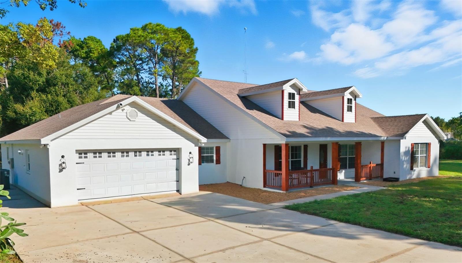 MAJOR PRICE IMPROVEMENT! SELLER HIGHLY MOTIVATED AND WILL CONSIDER ALL REASONABLE OFFERS! Don’t miss this beautifully remodeled, turn-key POOL HOME on over five fenced acres offering privacy, upgrades, and space for your Florida lifestyle. This property includes two storage sheds and a private communication tower, making it truly one of a kind. Inside, enjoy a welcoming front porch, formal living and dining rooms, and a spacious great room opening to the screened-in pool and patio. The updated kitchen features a new counter-height breakfast bar, granite countertops, and new dishwasher—perfect for entertaining. The split, four bedroom floor plan includes a Jack-and-Jill bath between two bedrooms, a private mini-suite, and a luxurious primary suite with two walk-in closets, garden tub, separate shower, and separate dual vanities. Major updates include a new roof (2019), new AC (2023) with 10-year warranty, new screen enclosure (2024), and comprehensive renovation (2025) with waterproof luxury vinyl plank flooring, fresh paint, new granite countertops, and updated fixtures. Additional updates include a new pool motor, garage door opener, gate motor, and enhanced landscaping. With every major improvement complete and a transferable one-year renovation warranty, this home is move-in ready and offers the perfect blend of comfort, style, and acreage living.