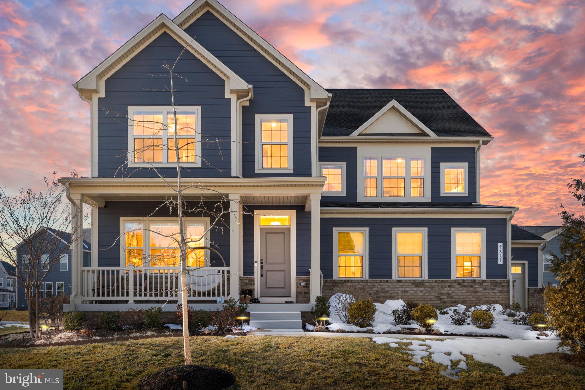 Welcome to this stunning 2023-built Colonial in the highly sought-after Hartland Community! This spacious 5-bedroom, 4-bath home offers over 3,350 sq ft above grade plus a fully finished basement — all freshly painted and move-in ready. The main level features gorgeous LVP flooring throughout, a desirable main-level bedroom with full bath — perfect for guests or multi-generational living. The open-concept kitchen impresses with upgraded finishes, quartz countertops, and a massive walk-in pantry, flowing seamlessly into the breakfast area and family room. A generously sized mudroom completes the main level.Upstairs, retreat to the luxurious primary suite featuring a elegant tray ceiling, two walk-in closets, and a spa-like en-suite bath with a separate soaking tub and shower stall. The bedroom level also boasts a versatile loft area, conveniently located laundry, and additional spacious bedrooms — all with walk-in closets. The finished basement is an entertainer's dream featuring an open rec room, wet bar hookup, a large den ideal for a home gym, plush carpet, and a walk-up exit to the backyard. Additional basement highlights include a sump pump, water softener, radon mitigation system, and rough-in for a full bath — plus ample unfinished storage space.Outside, enjoy easy access to a fenced backyard with generous space for outdoor living. The oversized 3-car garage rounds out this exceptional home. Zoned for Loudoun County Public Schools. This one checks every box — don't miss it!