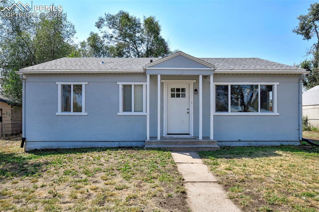 NEW FLOORING! NEW PAINT! NEW WINDOWS! Step into this fetching stucco cottage that opens to a large living room with new LVP flooring! Kitchen has been recently remodeled with tile plank flooring, subway tile backsplash and tall handsome cabinetry. Washer and dryer just off kitchen near back door with built-in cabinets above. THREE bedrooms and a renovated bath with window and luxury tile surround. Walls have original vertical inside corner moldings that meet the crown and baseboard moldings adding real character to this charmer! Near shopping, restaurants and park!