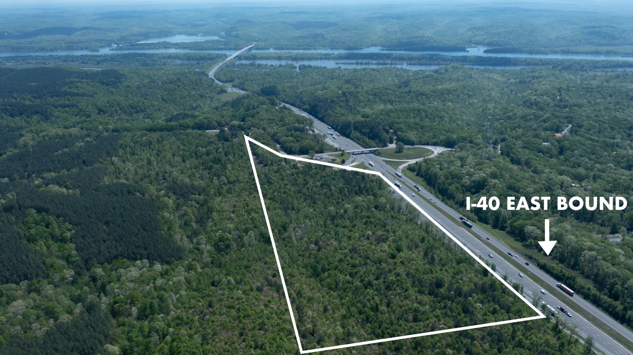Prime Commercial Land Near Kentucky Lake and River – Over 50 Acres in Opportunity ZoneStop scrolling. Here it is.This expansive 50+ acre parcel of mostly level land offers incredible potential for a wide variety of commercial developments. Strategically located at the cloverleaf of Exit 133 on Interstate 40, it provides unmatched visibility and accessibility – a true gateway to Benton County.    Opportunity Zone Incentives: Eligible for Tennessee's 25-year tax deferment for new commercial investments (residential use not eligible).    ideal for Multiple Commercial Uses: Perfect location for a hotel, restaurant, college facility, church, dormitory, recreational center, or other business ventures.3-Phase Power Available: Ready to support industrial or high-demand electrical needs.Improved Infrastructure: Seller recently added a third lane to the corridor approaching the exit – boosting traffic flow and accessibility.Proximity to Waterways: Near both Kentucky Lake and the river, enhancing the location's appeal for tourism-related or recreational development.This is a rare opportunity to acquire a high-visibility, high-traffic commercial site in a growth-focused area. Bring your vision and your buyer – let’s build the future of Benton County together!