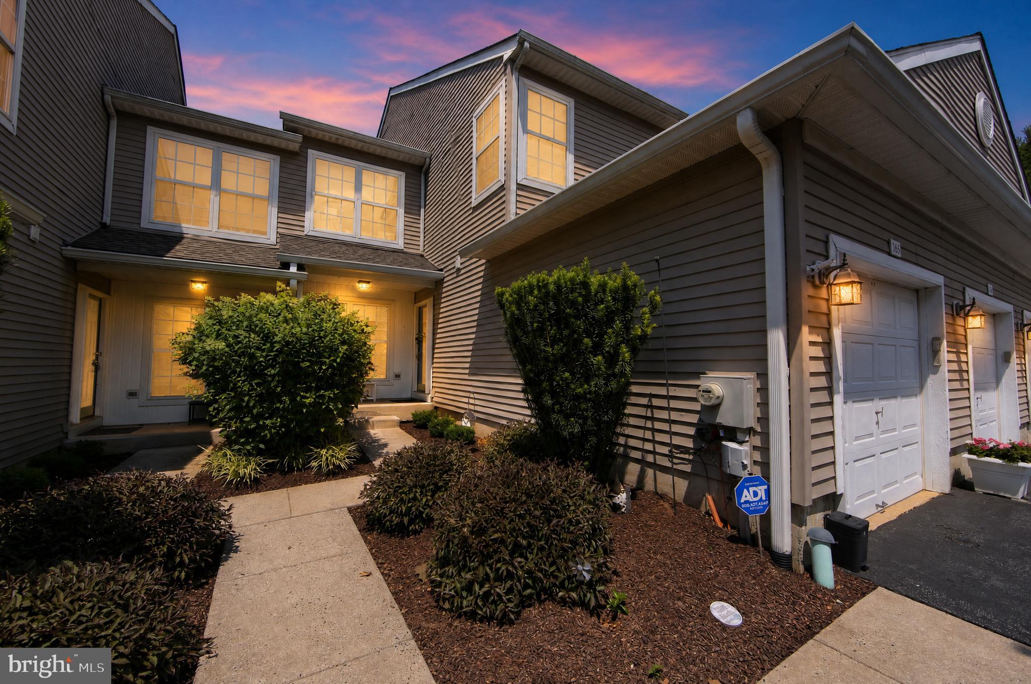 Beautifully updated Charlestown Hunt Franklin Model  townhome with a finished walk-out basement & open space views! Welcome home to 165 Lewisville Court, a beautifully maintained townhome in the sought-after Charlestown Hunt community within the Great Valley School District. This exceptional home offers the perfect blend of comfort, convenience, and low-maintenance living with numerous updates throughout. The remodeled kitchen (2025) is a true highlight, featuring crisp white cabinetry, granite countertops, ceramic plank tile flooring, stainless steel appliances, and a gas range. With abundant cabinet storage and workspace, this kitchen is both stylish and functional for everyday living and entertaining. The inviting living room features a natural gas fireplace and sliders leading to the deck overlooking the peaceful open space behind the home—the perfect setting for morning coffee or dining al fresco. The first floor also offers a convenient laundry room and a beautifully updated powder room (2025). Upstairs, the spacious primary suite features a vaulted ceiling, walk-in closet, large linen closet, and a generously sized private bath with double vanities and a stall shower. Every bedroom includes a ceiling fan for added comfort. The second-floor hall bath was updated in 2022 and features a luxurious Kohler walk-in bathtub and shower with soothing Jacuzzi whirlpool jets and a heated seat, creating a spa-like experience for comfort and relaxation. Additional storage is available with pull-down attic stairs, a partially floored attic, and built-in shelving. The finished walk-out basement provides incredible additional living space with a second natural gas fireplace, sliders leading to the rear green space, and abundant closets for storage. Whether used as a family room, home office, exercise space, or entertaining area, this level offers endless possibilities. Additional features include: freshly painted throughout, new carpet on stairs to the second floor and hallway (2025), a transfer switch installed in 2026 for a propane-powered whole-home generator, HVAC replaced (2016), a one-car garage with driveway parking, and plenty of guest parking nearby. Enjoy the carefree Charlestown Hunt lifestyle with amenities including lawn care, snow removal, a recreation center, swimming pool, tennis courts, pickleball, a tot lot, and walking trails. Conveniently located just minutes from the PA Turnpike slip ramp, Wegmans, Great Valley Corporate Center, downtown Phoenixville, shopping, dining, and entertainment. Combine all of this with Great Valley Schools, low taxes, and a peaceful setting backing to open space. 165 Lewisville Court is an exceptional opportunity to call home!