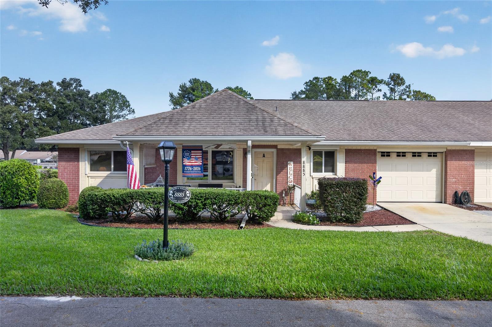 Welcome to your new life in On Top of the World, Ocala's premier active adult golf course community. This exceptional Birmingham model has been tastefully updated with a beautiful two color kitchen with striking under cabinet lighting. The kitchen has a small office space with storage behind it. The bathrooms have been updated and there is even a smart bidet in the guest bathroom. This gorgeous villa features a full width of the house Florida/Sunroom with picture windows that can be a craft room, office or den or have multiple uses at it is big enough. You can enter from the primary bedroom and the dining room. A screened patio is beyond the Florida room. The entire home has high quality tile floors throughout. The roof was completed in 2018 and a new HVAC in 2024. New garage door in 2024 that also has a roll up automatic screen, energy efficient thermal windows, new interior doors and inside paint as well as newer ceiling fans and lighting. The primary bedroom closet has custom shelving to organize in style. This model has a 1.5 car garage going the entire length of the house and the laundry area and golf cart space is in the back. There is a workbench and shelves in the garage as well as a 2nd refrigerator. Extra insulation has also been installed. To protect your investment there are automatic hurricane shutters, hidden until you need them with flick of a switch simplicity to bring them down. The golfcart is available and all of the very tasteful furniture is also available, including smart TVs and an electric fireplace. This home has very nice landscaping and no homes behind it. At 1755 square feet it is one of the largest villas available. You must see it to appreciate it! Community features include tennis, swimming pools, pickleball, library, gyms, game rooms, education, farmer's market, entertainment, clubs plus more! This villa is located near the front of the community where you have golf cart access to two shopping centers, a Publix, and many restaurants. It is walking distance to the Rec Center pool and gym. Call for your private showing, this unique home won't last long!