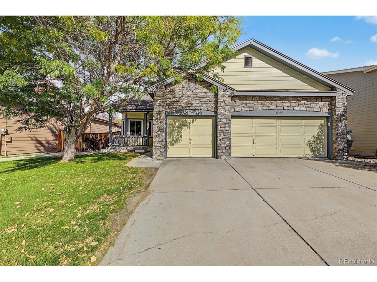 Experience the perfect blend of comfort, style, and functionality in this gorgeous 3-bedroom home! Nestled on a desirable North/South-facing lot, this property boasts a 3-car garage and attractive stone accents. Appealing interior features an inviting living room with a lovely bay window, excellent for welcoming guests. Large great room, bathed in natural light and enhanced by a delightful fireplace, creates the ideal setting for effortless entertaining and cozy evenings during the cooler months. Spotless kitchen displays glossy stainless steel appliances, a convenient pantry, crisp white cabinets, granite counters, a two-tier breakfast bar, and a pass-through window. Impeccable primary retreat is complete with a walk-in closet and a private ensuite with a shower and tub combination. A versatile den provides the ideal space for a dedicated office, while the HUGE bonus room in the basement offers endless possibilities as a recreation room, hobby space, or playroom. Tranquility awaits in the serene backyard, which includes a relaxing deck and mature trees that give refreshing shade. Hurry! Make it yours before it's gone!