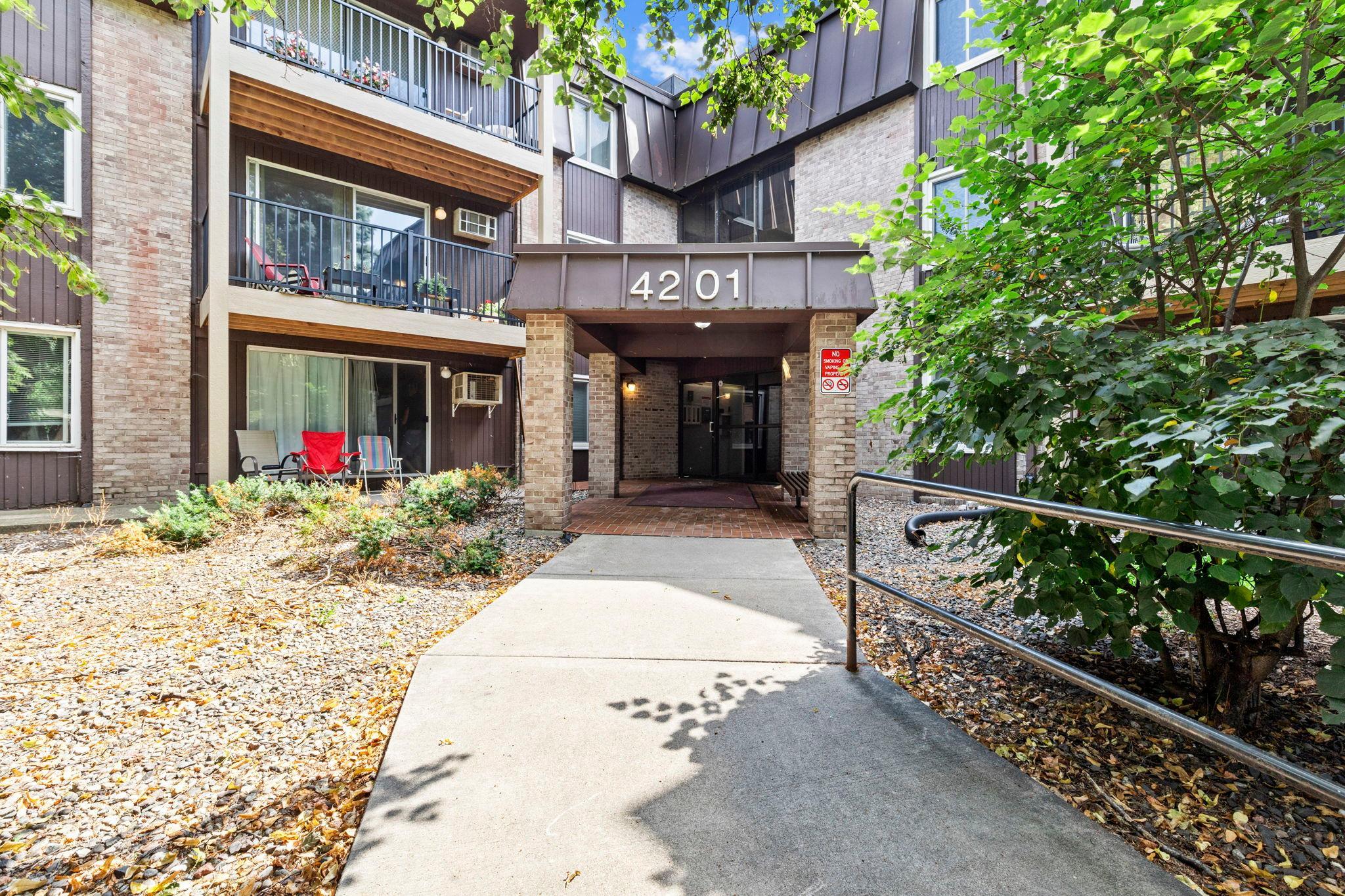 Welcome to this updated one-bedroom, one-bathroom condo nestled in a quiet Brooklyn Center neighborhood, conveniently located near dining, shopping, local amenities, and Highway 100 for an easy commute. Enjoy being just steps from Twin Lake Beach Park, offering a beautiful beach, walking trails, and outdoor recreation. The building features an impressive array of amenities, including an outdoor pool, workshop, recreation room with pool table, fitness room, sauna, onsite laundry, and underground parking with an assigned space included with the unit. Step inside this well-maintained and thoughtfully updated home featuring luxury plank flooring that extends throughout the kitchen and dining areas. The kitchen offers stainless steel appliances, ample white cabinetry, and generous granite countertops, creating a functional and inviting space that flows seamlessly into the dining area complete with a ceiling fan. The adjacent living room features cozy carpeting, recessed lighting, a unique light fixture with a discreet fan, and access to the private balcony—perfect for enjoying your morning coffee or unwinding at the end of the day. The spacious bedroom offers dual closets, carpeting, and convenient access to the full bathroom featuring a single vanity, tub and shower combination, and a nearby hallway linen closet for additional storage. Don’t miss the opportunity to make this charming, move-in-ready condo your own in a fantastic location close to everything you need!