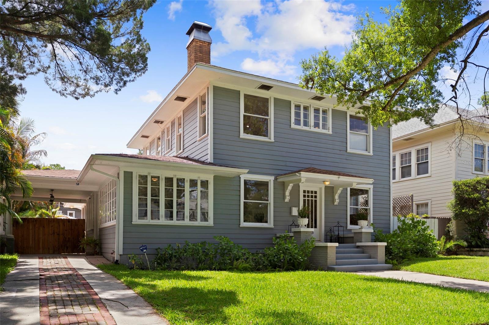 Offered for the first time in over 25 years, this rare Historic Hyde Park gem seamlessly blends timeless character with modern luxury, just steps from the vibrant shops and restaurants of Hyde Park Village and the scenic waterfront of Bayshore Boulevard. Lovingly maintained and thoughtfully updated, this exceptional residence offers the perfect balance of historic charm and contemporary convenience in one of South Tampa's most coveted neighborhoods all in an X Flood Zone. Spanning 2,644 square feet, the home features 4 Bedrooms, a Dedicated Office, 2.5 Bathrooms, a Screened Porch, and an incredible outdoor living area designed for year-round enjoyment. The sparkling POOL is equipped with an Automated Solar Cover, while the expansive brick-paver patio, BBQ area, and storage shed create the ideal setting for entertaining, relaxing, and embracing the Florida lifestyle. Inside, timeless architectural details abound, including beautiful original pine & oak flooring, beamed ceilings, custom built-in cabinetry, and a wood-burning fireplace that serves as the centerpiece of the formal living & dining rooms. Beyond the charming historic entryway, the home opens to a spacious family room and an inviting chef's kitchen with a breakfast area, creating a natural gathering place for both everyday living and special occasions. Upstairs, the thoughtfully designed floor plan provides comfortable space for family and guests alike. The Primary Suite serves as a private retreat, featuring its own fireplace (capped), a cozy sitting area, walk-in closet, and a spacious 4 piece bath. Bedrooms 2 & 3 offer matching layouts with generous closet space, while the fourth bedroom provides exceptional flexibility as a nursery, home office, fitness room, or creative studio. A dedicated first-floor office provides the private workspace today's buyers desire, tucked away from the main living areas yet filled with natural light. Additional conveniences include a second-floor laundry room, central vacuum system, and exceptional off-street parking with a new two-car garage, carport, and extended driveway accommodating up to three vehicles. Significant system upgrades enhance efficiency and long-term value, including Bosch inverter heat pumps (2021), capable of cooling the home at a fraction of the cost of traditional HVAC systems, and a high-efficiency heat pump water heater with recirculation system providing near-instant hot water. All utilities have been placed underground, preserving the beauty and charm of the property without visible overhead wires or utility lines. For those seeking future flexibility, the owner has architectural plans available for a fifth-bedroom guest suite and a second-story garage apartment/ADU. Located in one of Tampa's most beloved historic neighborhoods, just moments from Hyde Park Village, Bayshore Boulevard, Downtown Tampa, and the city's premier dining, shopping, and entertainment destinations, this is a truly rare opportunity to own a landmark home that offers character, space, modern efficiency, and room to grow.