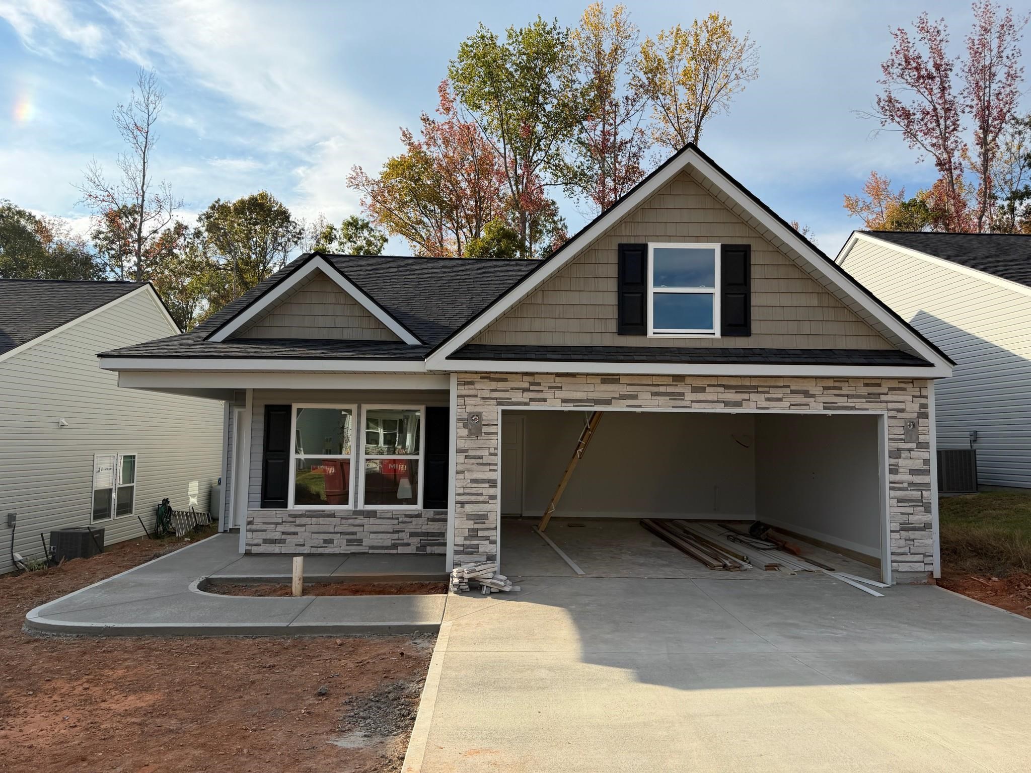 The CLIFTON plan (Lot 41) has a spacious open living area and split bedrooms. Granite countertops, crown molding with rope lighting, upgraded cabinets and many more features included. 12' x 12' sunroom and 10' x 12' back patio overlooks the private yard backing up to wood line. 30-year architectural shingles, site-built construction, and a 10 year limited warranty are included to give you peace of mind.  Seller Concession toward Buyer’s Closing Costs or Rate Buy Down available. *Virtual tour reflects same house plan, not exact house.