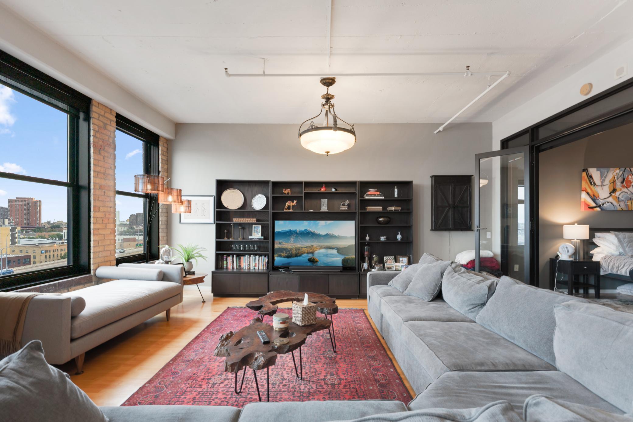 Welcome to your dream condo at International Market Square, where your Soho-style Loft, meets timeless elegance. Step into an authentic loft experience featuring 12-foot ceilings, exposed brick, antique hardwood floors, & awe-inspiring views of the downtown skyline & Target Field from your own private balcony. This open floor plan boasts 1 bedroom + office with a full wall of windows filling the entire space with natural light.  Immerse yourself in the vibrant surroundings – take a short stroll to the Farmer's Market, North Loop, the Light Rail, Target Field or explore the myriad of restaurants at your doorstep. Don’t miss this rare opportunity to own a truly one-of-a-kind loft in one of downtown Minneapolis’s most iconic buildings.