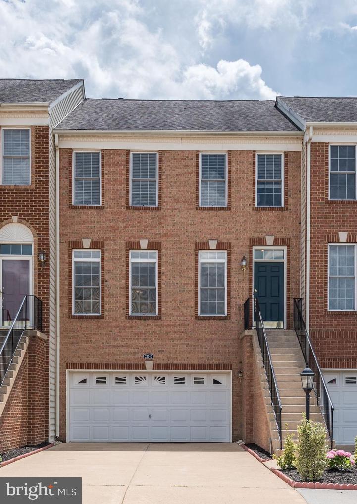 Excellent 3 bedrooms,3 full baths and 1 half bath Toll Brothers Bradbury model, 3 levels,2 Car garage, over 2,700 sq ft Brick front Townhome Sought after Loudoun valley Estates Community. is located in the highly sought after community of Loudoun Valley Estates, close to the Toll Rd, Loudoun County Parkway and the upcoming Silver Line Metro. With 3 fully finished levels, this home has an open floor plan with hardwood floors on the main level that reflect a ton of light! The entire house has just been painted top to bottom with new carpeting on the upper and lower stairs and new light fixtures. There are 2 HVAC units that were replaced 4 years ago. On the main level you will find the Living/Dining room combination as well as the half bath. The main living area has crown molding and chair rails throughout. The renovated kitchen is the place to gather in this house, with it's large center island and new Quartz Counter tops. The cabinets are a lovely grey with new back splash. All of the stainless steel appliance are upgraded and only a few years old. The bump out in the kitchen can be used for a small table or chairs. What really makes the kitchen cozy is the gas fireplace with granite surround and a built-in cabinet. Off of the kitchen is the composite deck to enjoy during the warm weather months. Upstairs you will find the Primary Bedroom with hardwood floors, a cathedral ceiling, a reading nook, two walk-in closets and the Primary Bathroom with a soaking tub, a shower, ceramic tile and dual vanities. Also upstairs is the Laundry area with newer washer and dryer, the 2 additional bedrooms and the 2nd Full bath with new Tile Plank flooring. To finish off this great floor plan is the fully finished basement that is currently used as a theatre/media room but can serve a number of uses! The basement has new luxury vinyl plan flooring and also has the 3rd full bathroom. The basement has a walk out that leads to the fully fenced back yard and a composite lower deck. The 2 car garage is accessible through the basement. Loudoun Valley Community offers Swimming pools, tot lots, fitness centers, tennis and basketball courts, clubhouses, walking trails.Minutes from the Silver metro, Loudoun County Parkway, Rt 50, Rt28, Rt 7, Ashburn Metro, Brambleton town center, One Loudoun, Dulles Airport, shopping and restaurants makes this a commuter's dream.Close to Brambleton town center, upcoming metro and Toll Road-267. Must See A+++