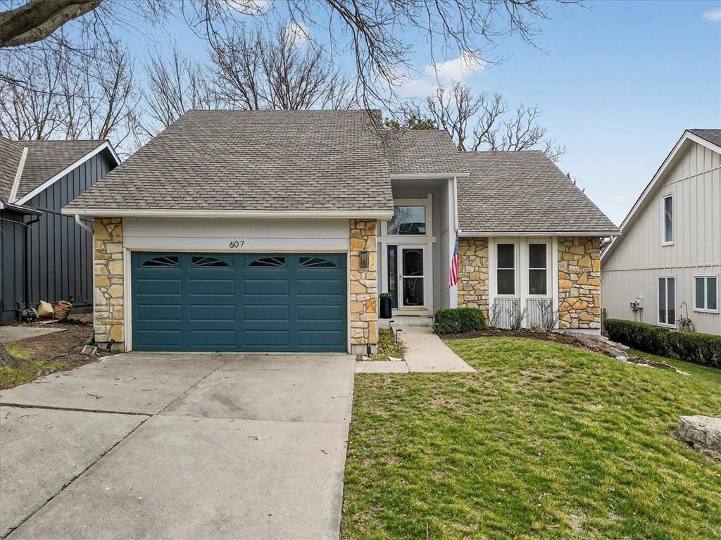 Positioned on a quiet cul-de-sac within the highly coveted Lakewood community, this 1.5-story residence offers a lifestyle defined by both recreation and ease, with golf and the lake just moments from your door. The setting feels both tucked away and connected, with convenient highway access enhancing everyday livability. Inside, the home is anchored by a soaring living room where elevated ceilings and generous proportions create a true sense of volume. Designed as the heart of the home, this space effortlessly accommodates both relaxed daily living and larger gatherings, with a natural flow that feels open yet intentional. Recent updates—including fresh interior paint, updated fixtures, and a new electrical panel—introduce a sense of ease and confidence, allowing the next owner to step into a home that feels both refreshed and well-considered. The first-floor primary suite serves as a private retreat, distinguished by vaulted ceilings and a spacious bath complemented by a well-appointed walk-in closet. Each additional bedroom is thoughtfully designed with its own en-suite bath, offering comfort and privacy for both residents and guests. The lower level expands the home’s versatility, finished with entertaining in mind while still providing substantial storage. A dedicated putting green introduces a unique, lifestyle-driven element—an unexpected feature that reflects both leisure and personalization. Set within one of the area’s most sought-after communities, this residence brings together space, setting, and a highly livable floor plan—delivering a home that feels both dynamic and effortlessly comfortable.